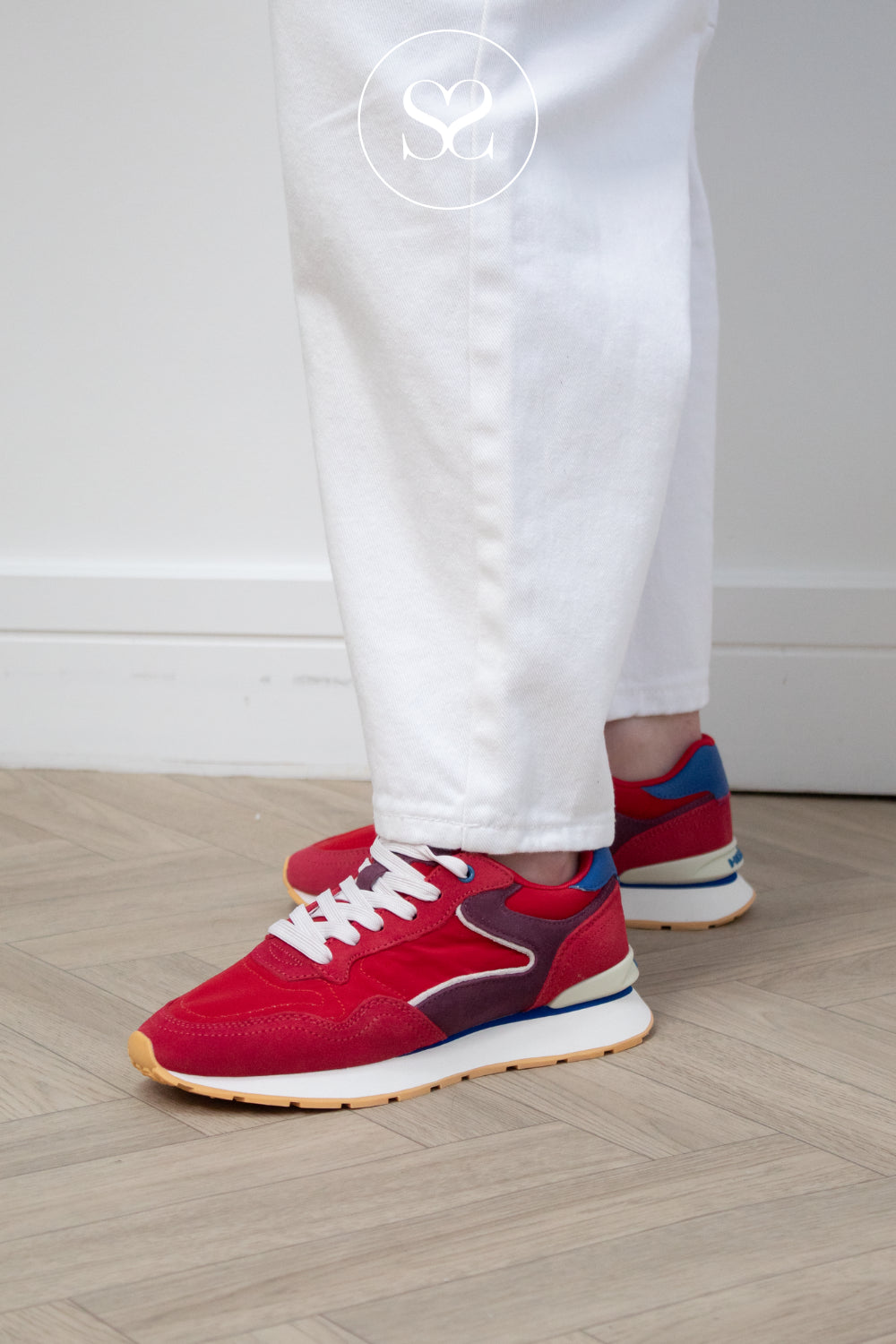 Woman wearing red sneakers from HOFF with supportive wedge sole - Dopamine style