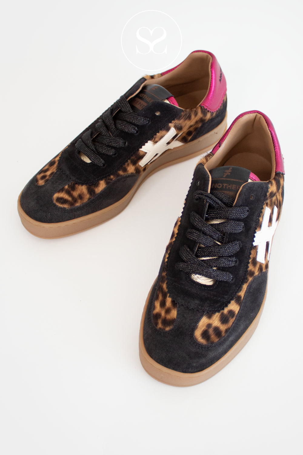 Pair of black sneakers with leopard print and pink accents on a white background