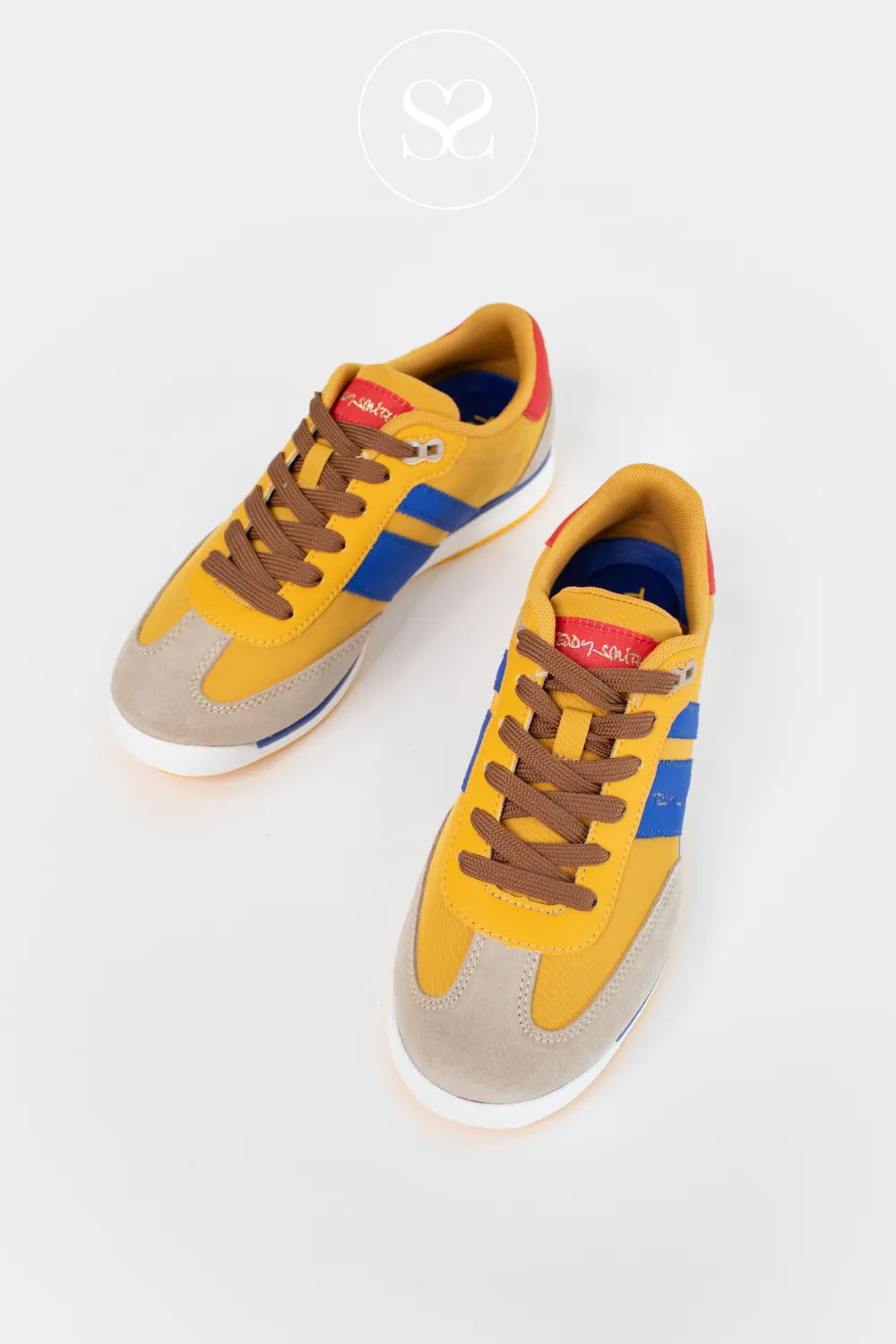 Yellow sneakers with brown laces and blue accents on a white background