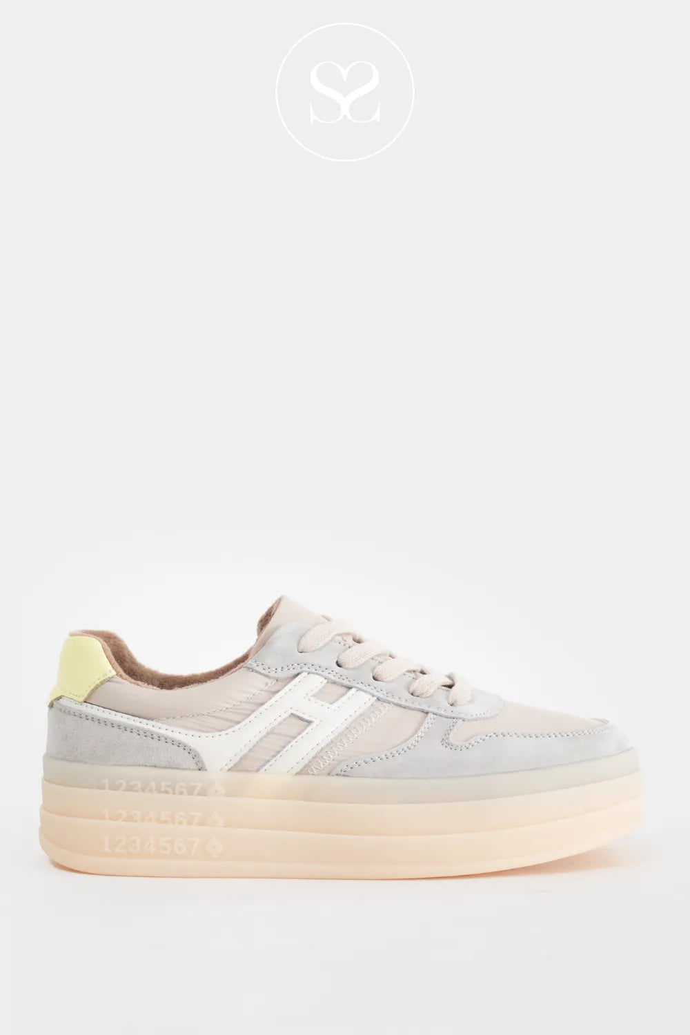Grey flatform sole trainers with laces and white hashtag logo on the side. 