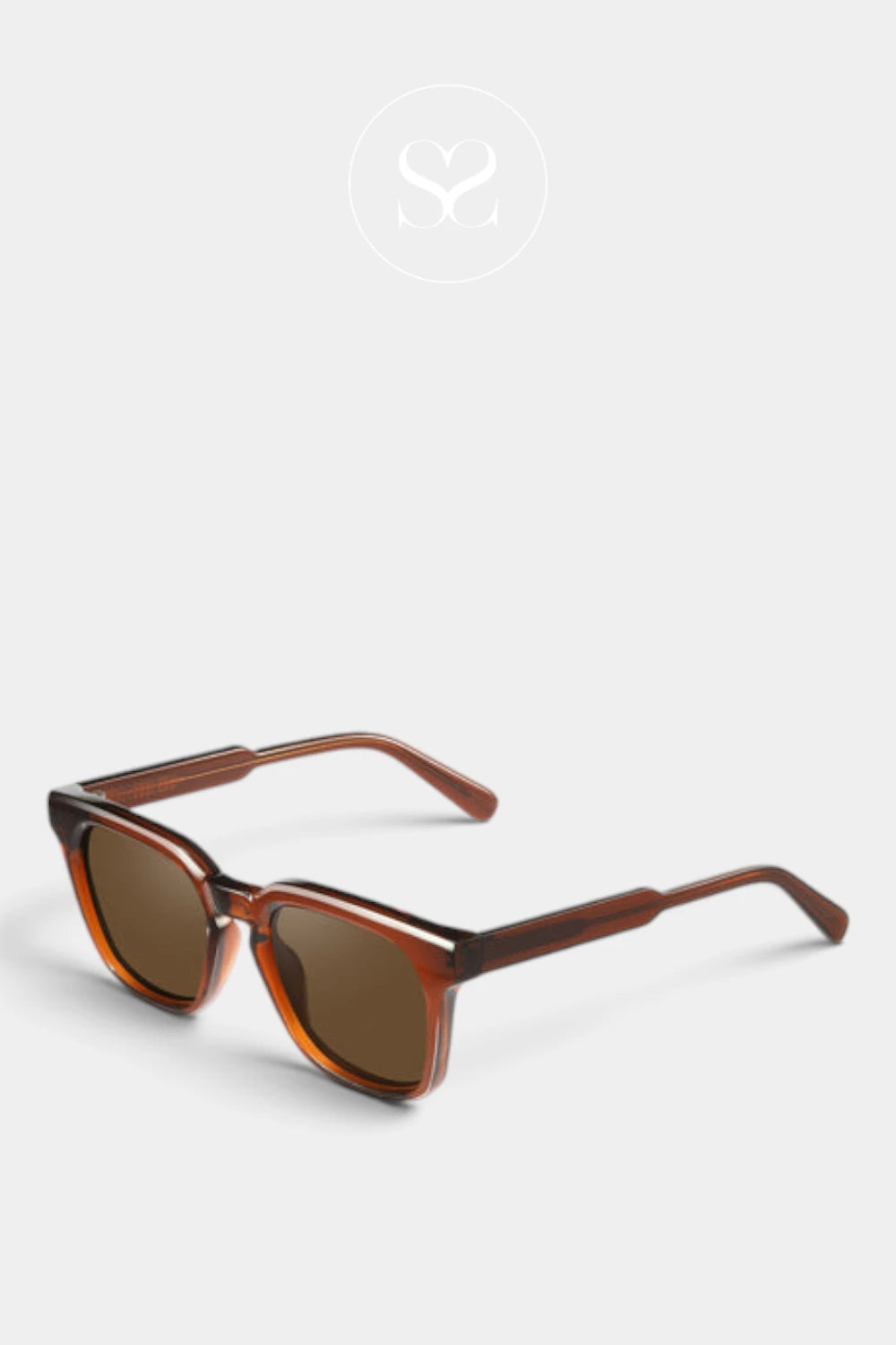 A pair of sunglasses with a translucent brown acetate frame and brown tinted lenses, shown on a light gray background with a faint brand logo above.