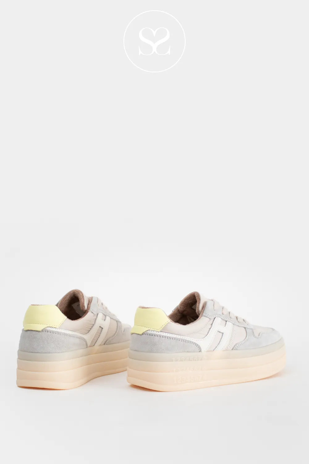 Chunky trainers with high sole in grey suede and white logo on the side. Laces and yellow heel cap.