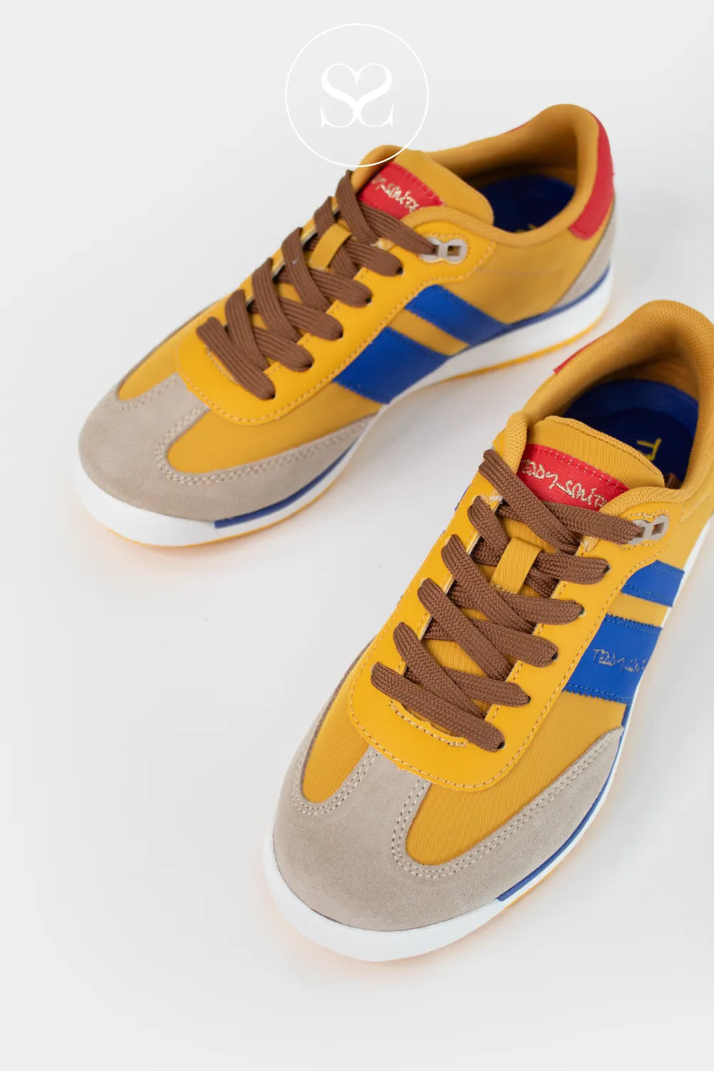 Colourful sneakers for Women with a mix of yellow, blue, brown, and beige on a white background