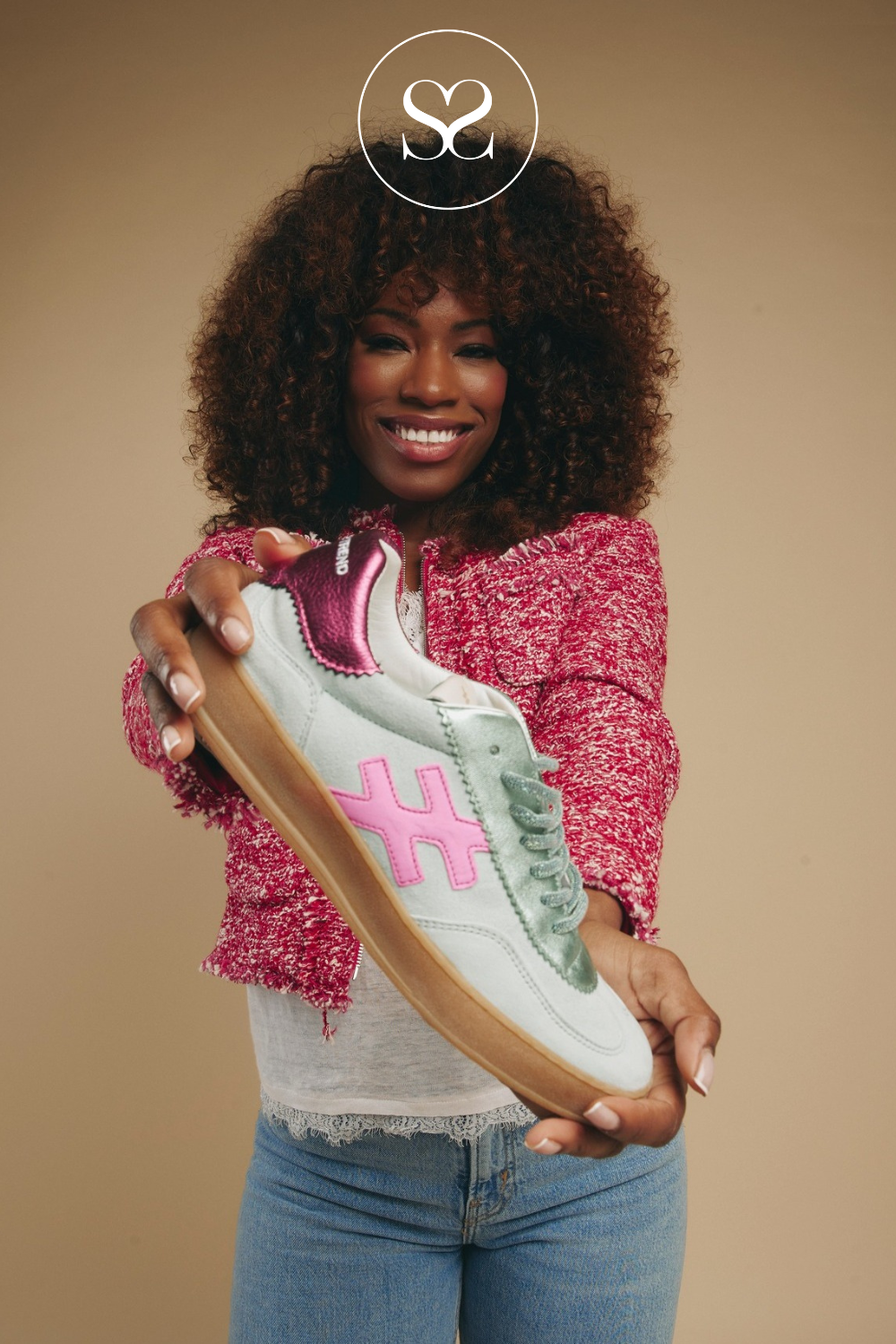 Photo: Woman holding Another trend low profile trainers in mint