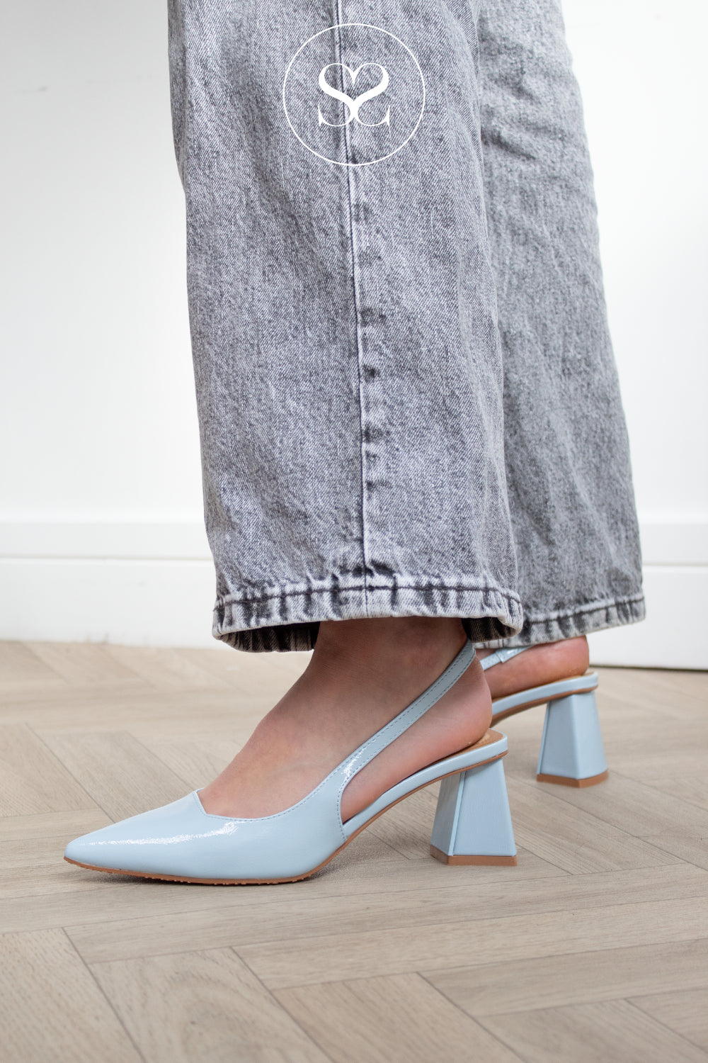 Woman wearing light blue pointed toe slingback heels from Bianco - available in Ireland