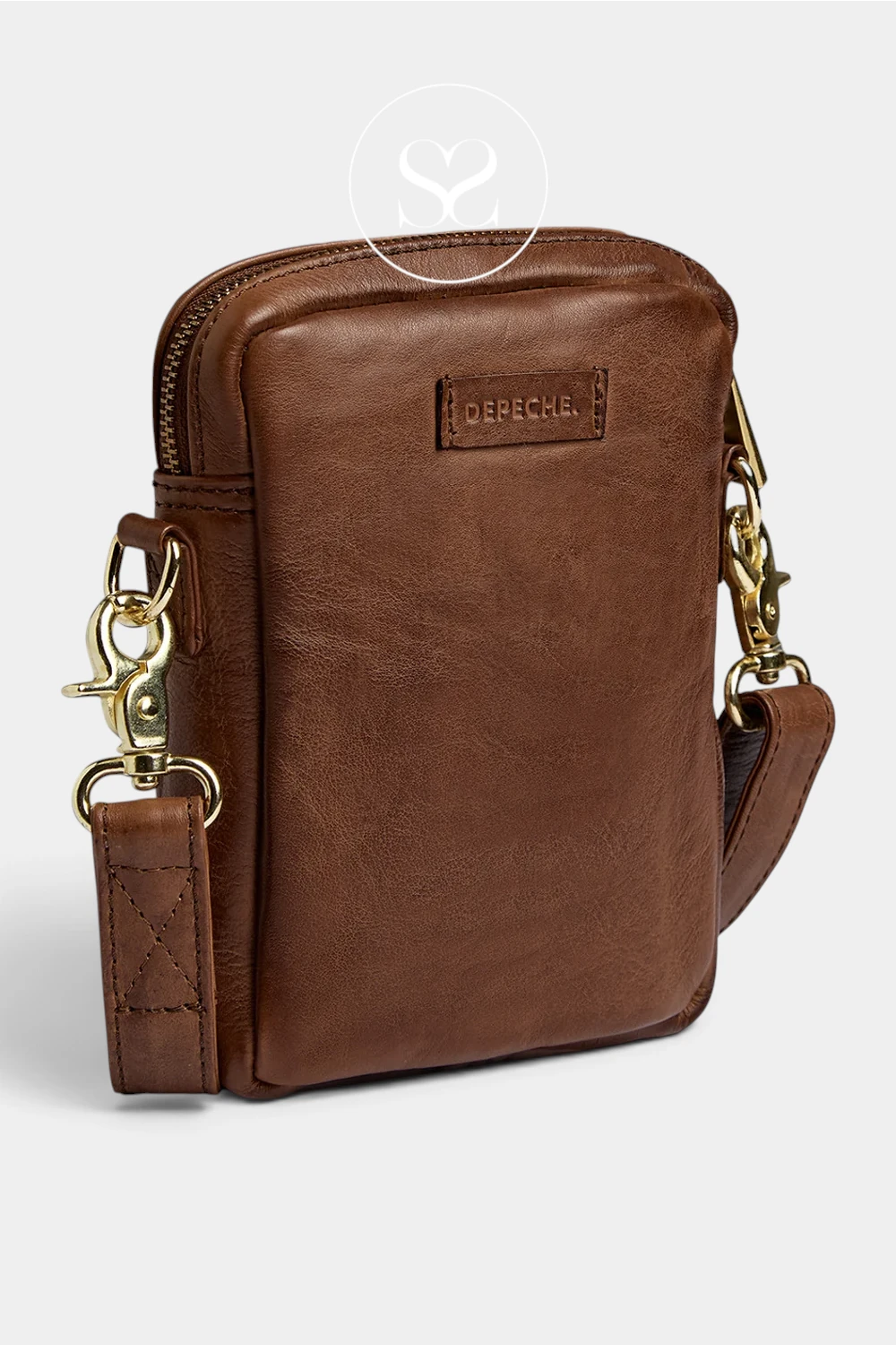 A brown leather crossbody phone bag with gold-tone hardware and a branded 'DEPECHE' patch on the front, shown on a light gray background.