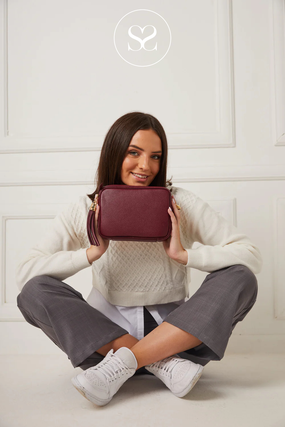 Burgandy leather crossbody bag with tassel from elie beaumont