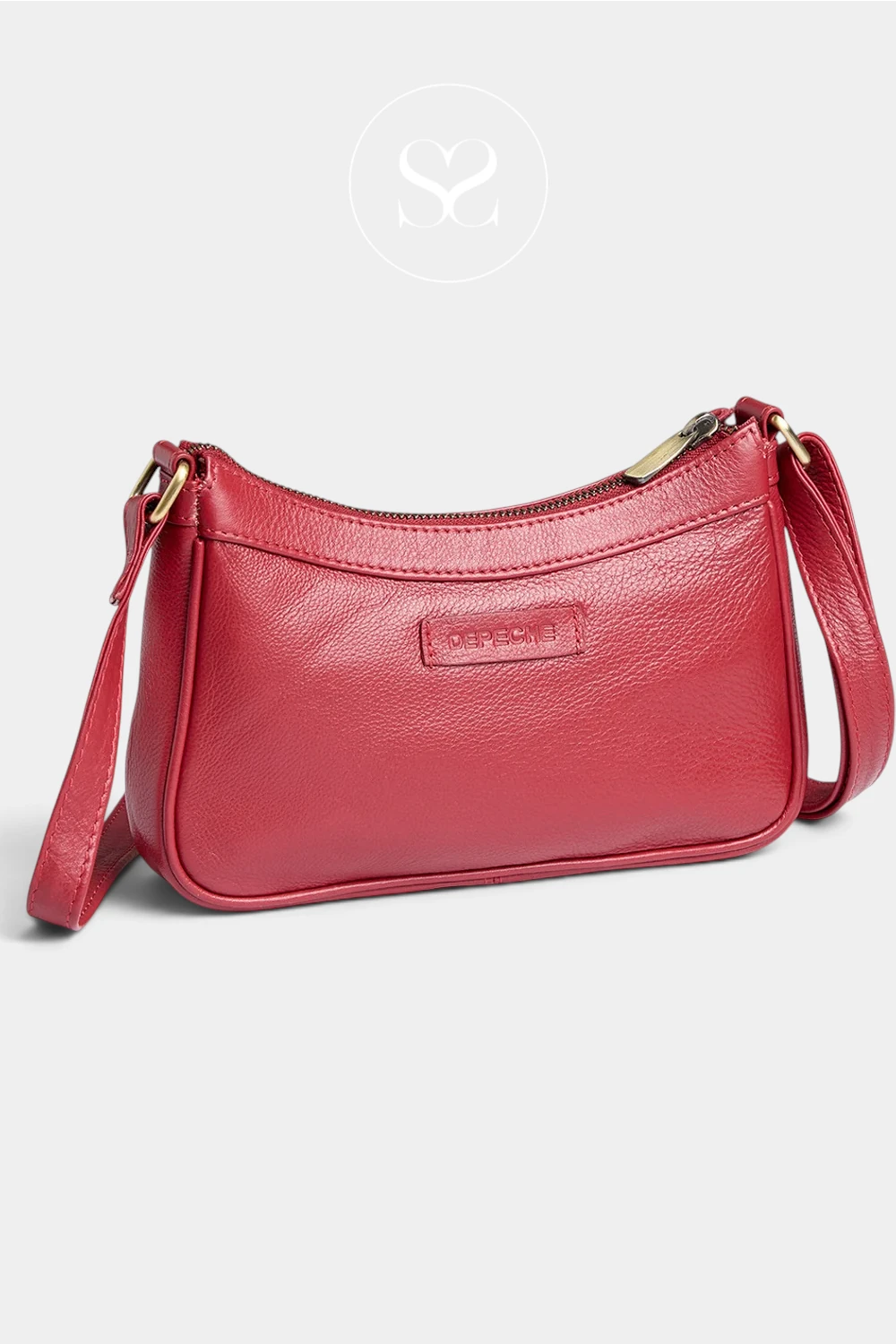 A red pebbled leather crescent-shaped shoulder bag with a top zipper, , and a matching red leather strap, shown on a light gray background with a faint circular logo above.