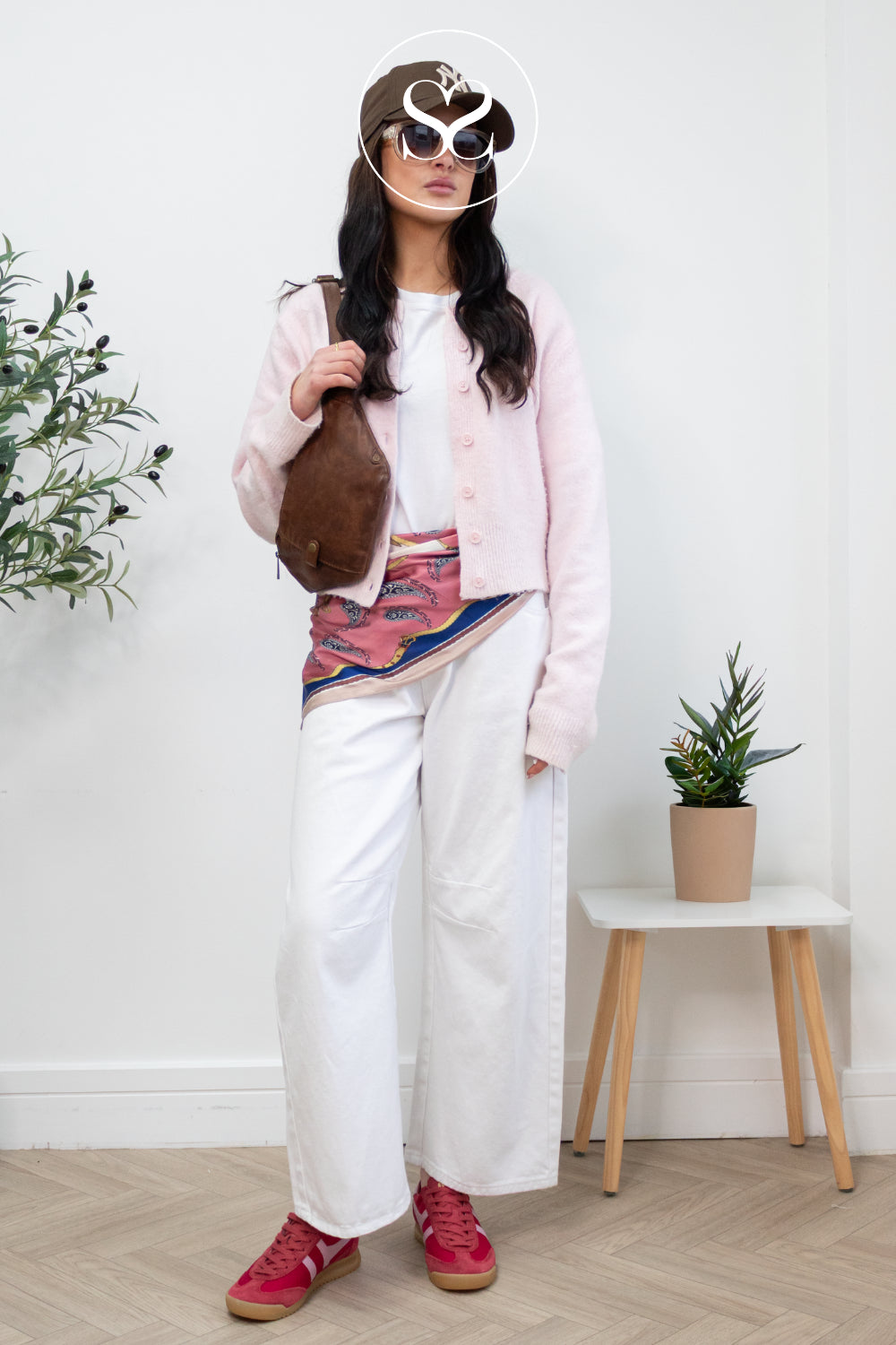 Woman wearing gols red and pink trainers in Ireland