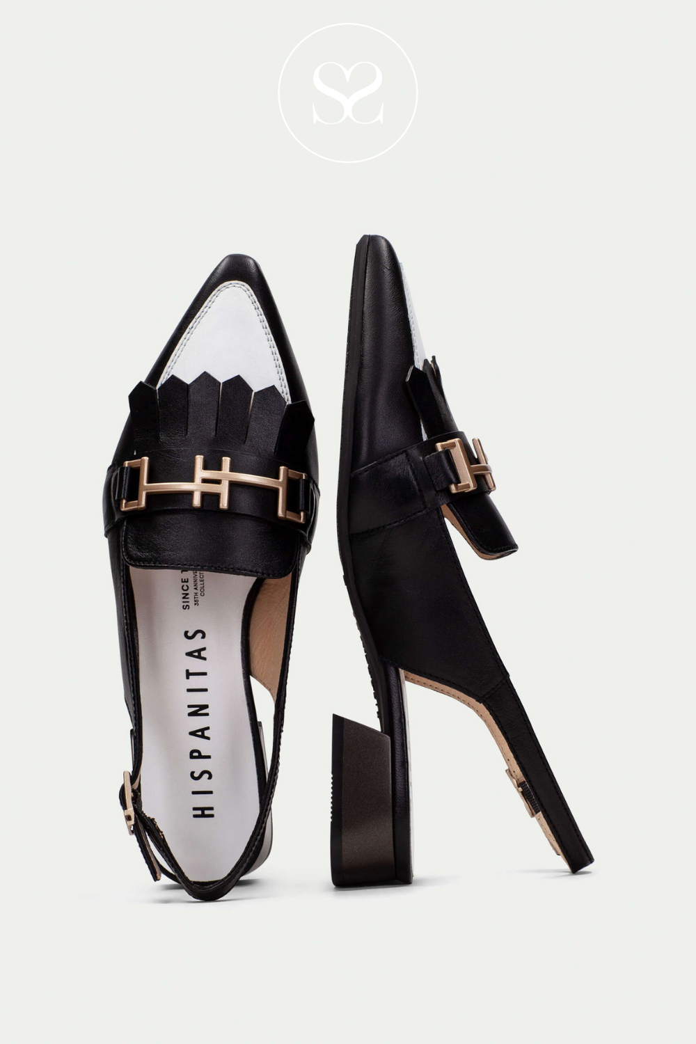 HISPANITAS CHV253817 BLACK AND WHITE POINTED TOE SLINGBACK LOW HEELED PUMPS WITH ADJUSTABLE STRAP, GOLD BUCKLE AND FRINGING
