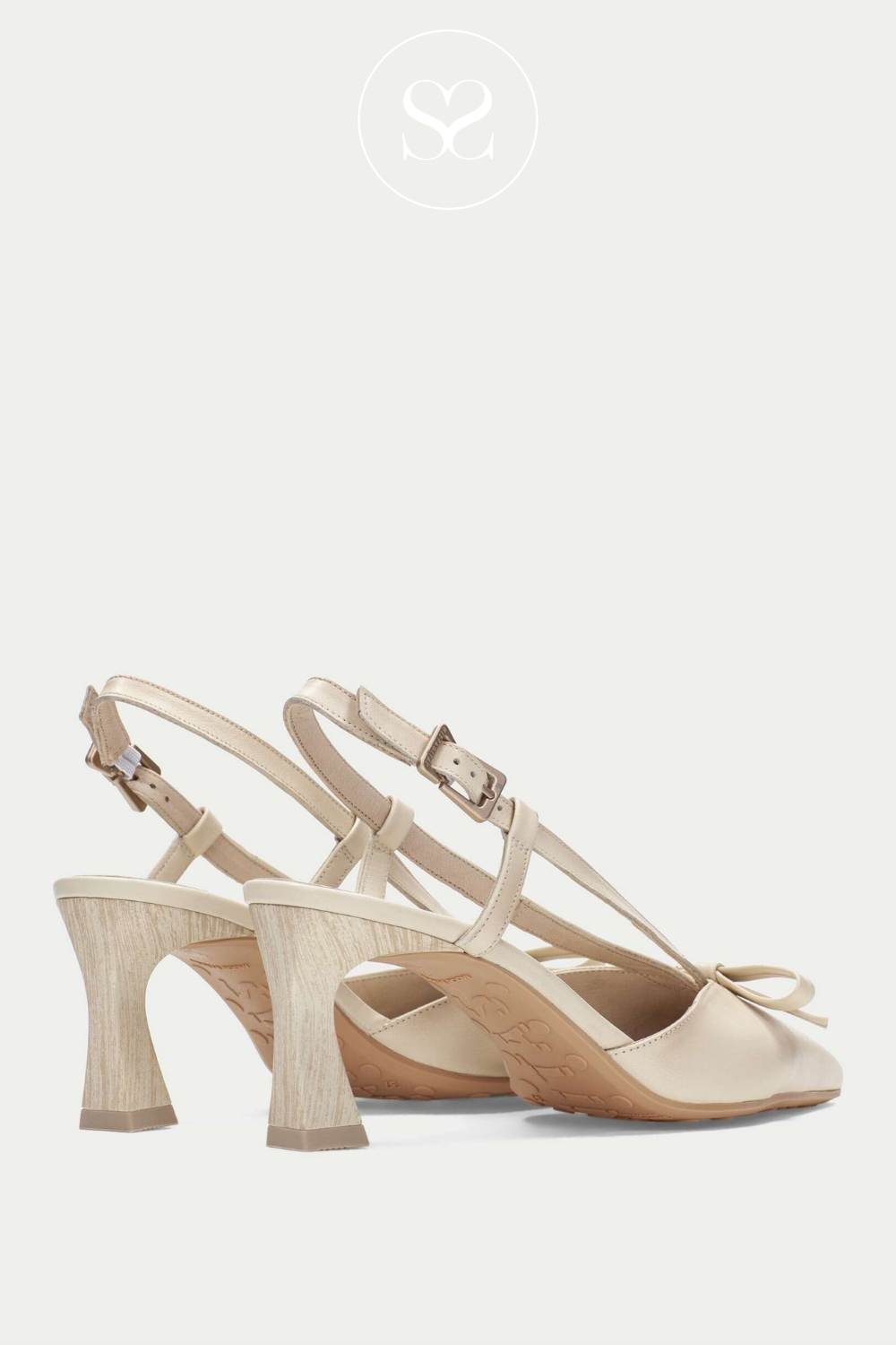 Hispanitas modern classy high heels with adjustable ankle strap and pointed toe. Cream leather with bow