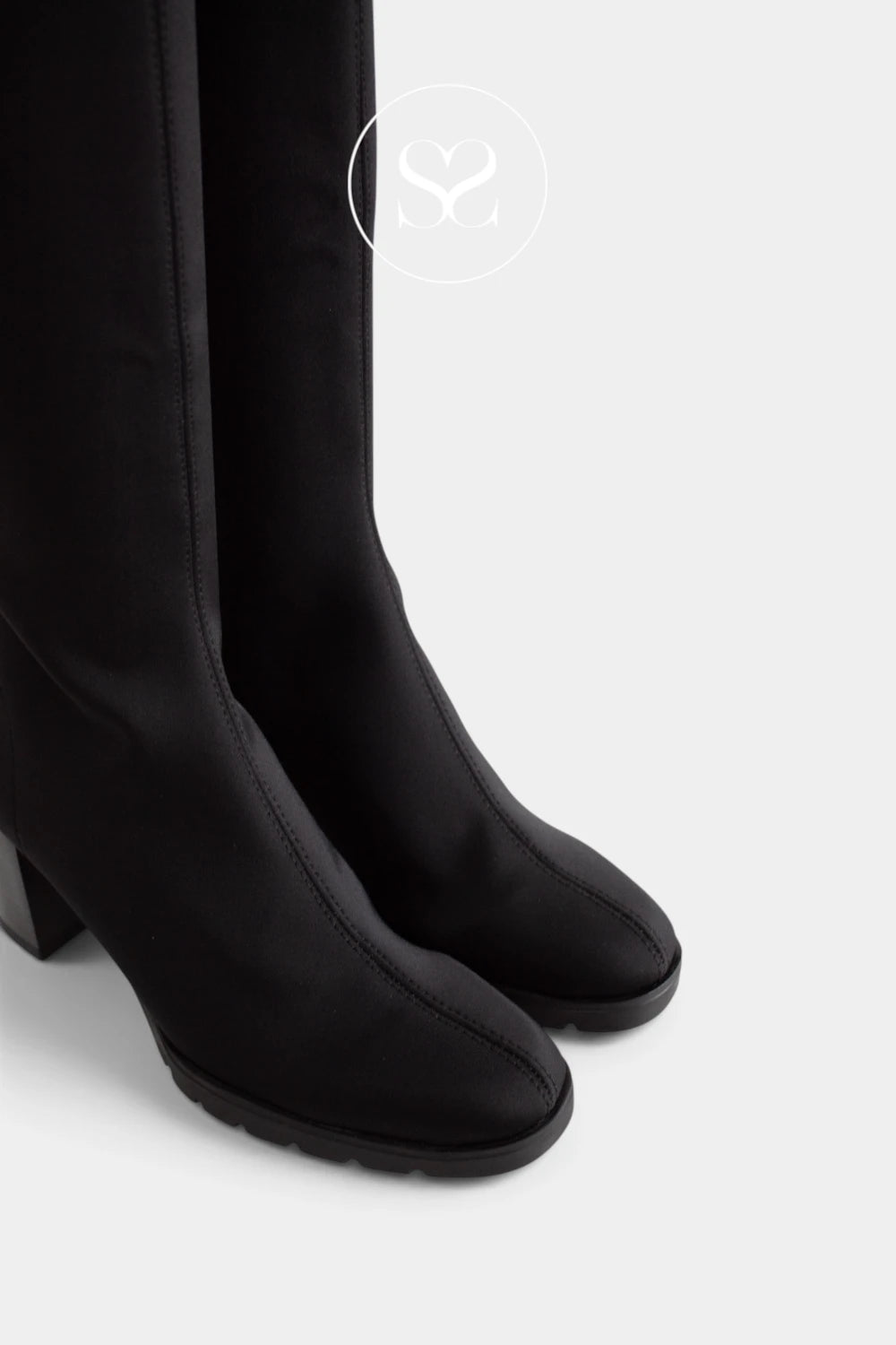 Miss Elastic Black knee-high boots with a matte finish, shown from a side profile view against a light grey background.