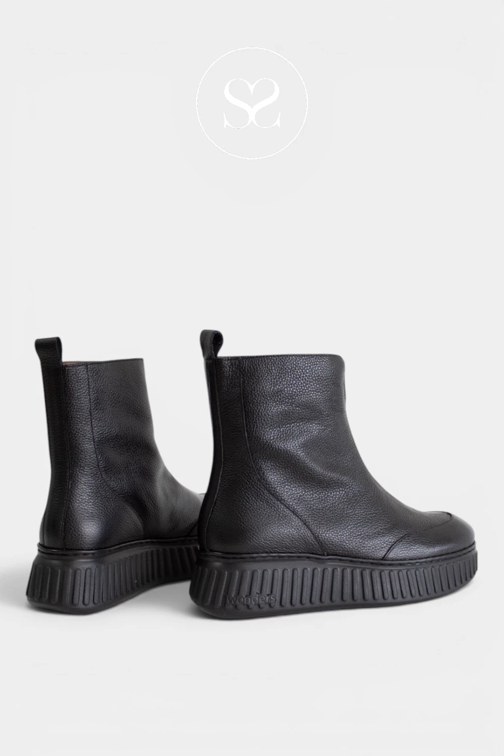 Women’s black leather ankle boots featuring a statement front zip closure and a clean, contemporary silhouette - Ireland
