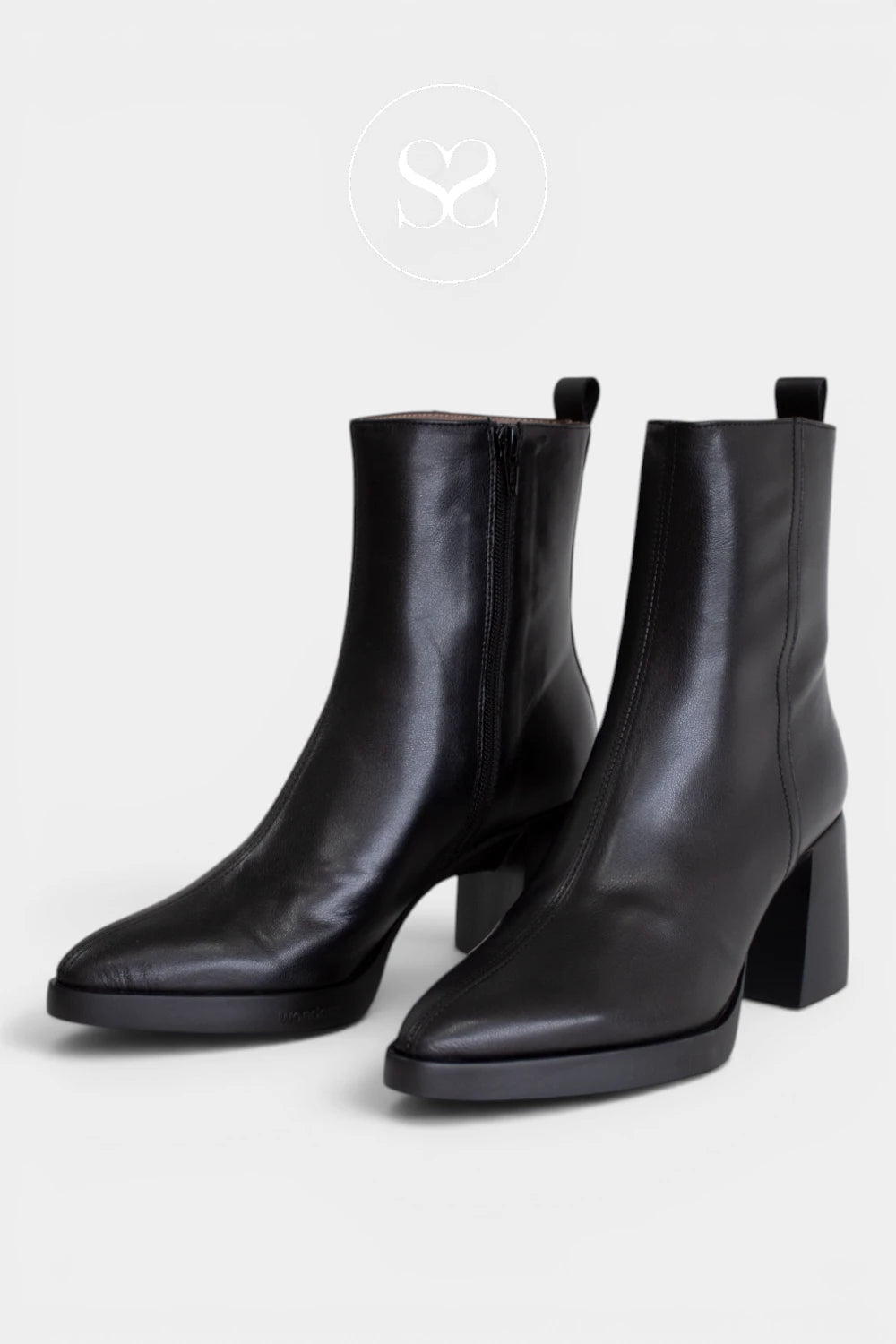 Smart black ankle boots for women with a pull tab, slim platform sole and polished silhouette, ideal for work, evenings and everyday wear -Ireland
