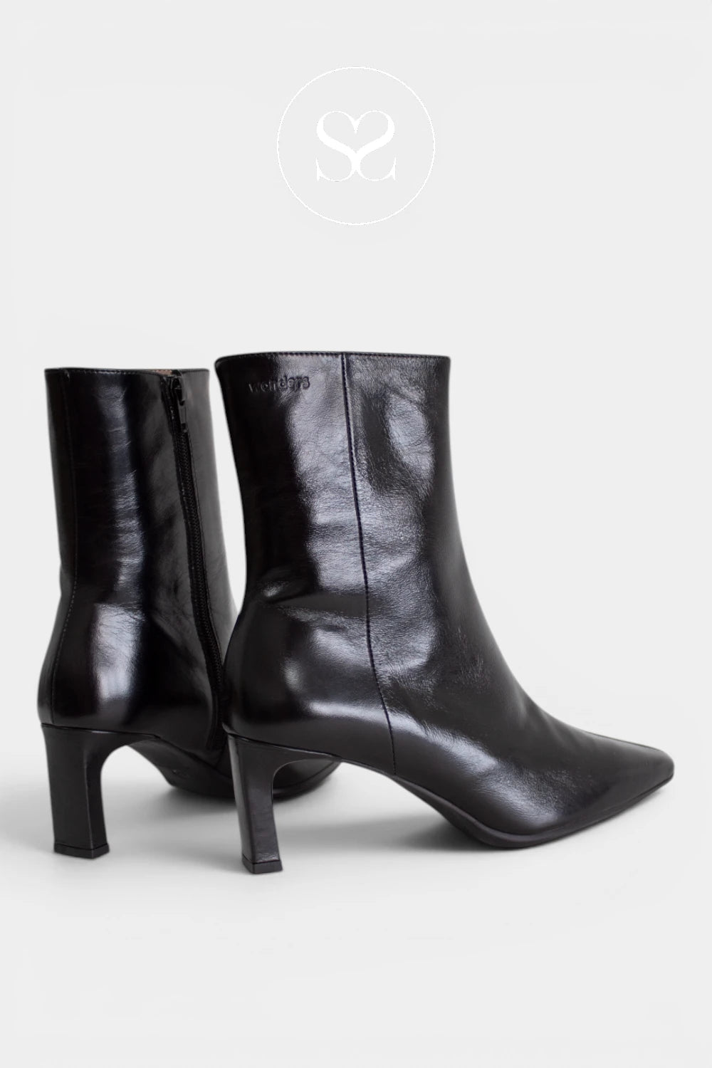 Smart black ankle boots for women combining a fitted shaft, refined heel and minimalist design, ideal for work, evenings and occasion outfits - Ireland