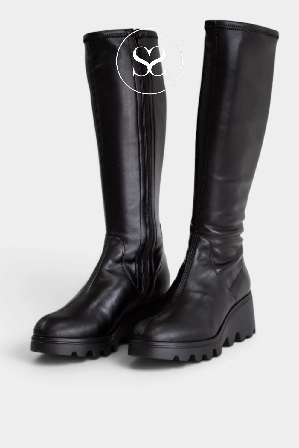 Chunky black knee boots with a grippy tread sole, ideal for autumn and winter outfits.