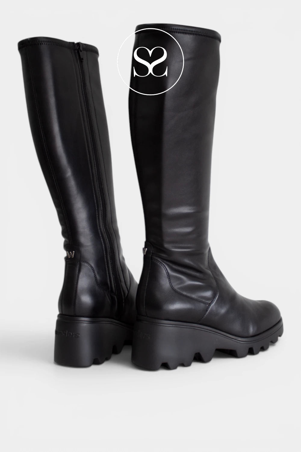 Comfortable black long boots for women with a supportive wedge heel and practical everyday design.