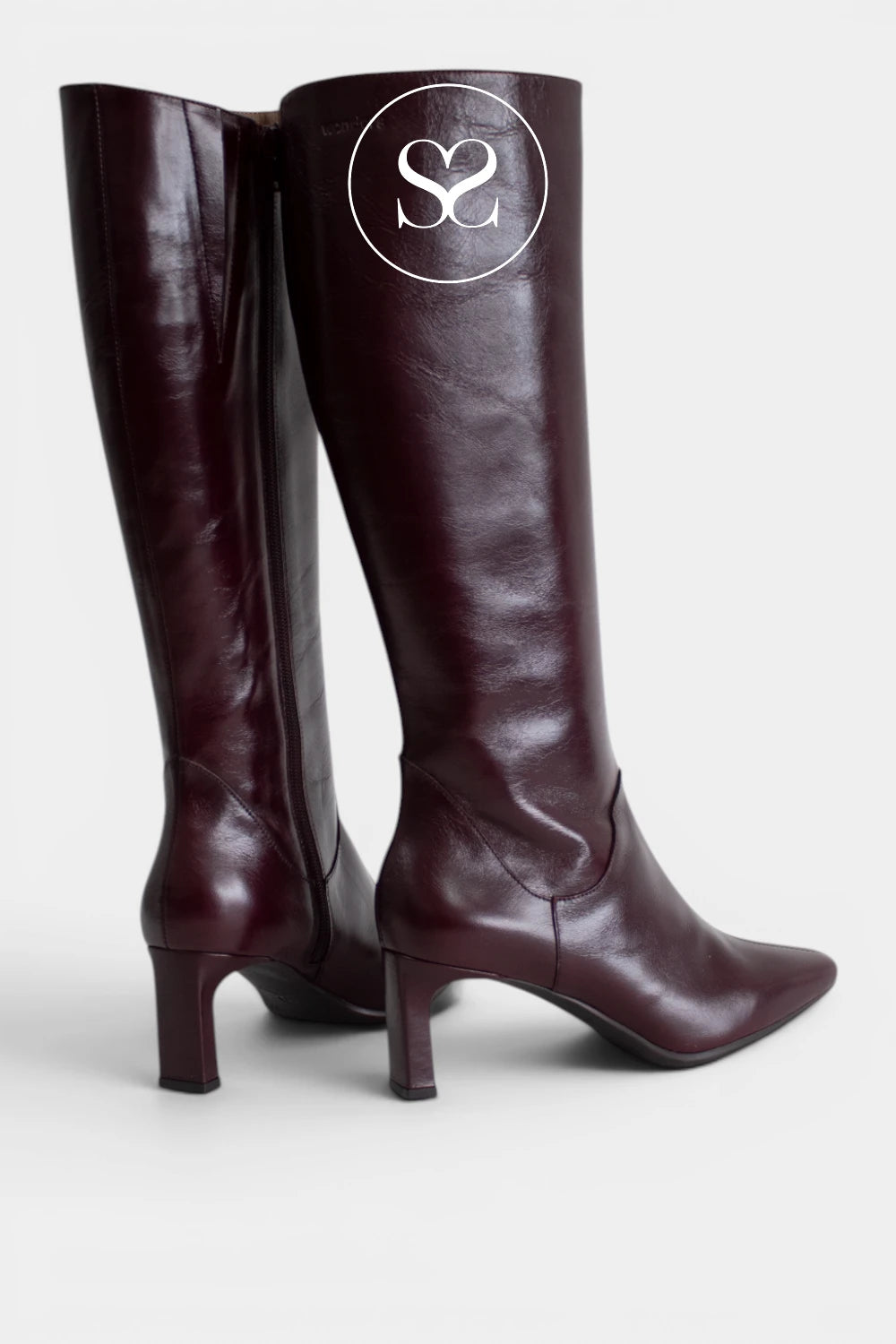 Burgundy heeled knee-high boots with a slim mid-height heel for an elegant look that still feels easy to wear