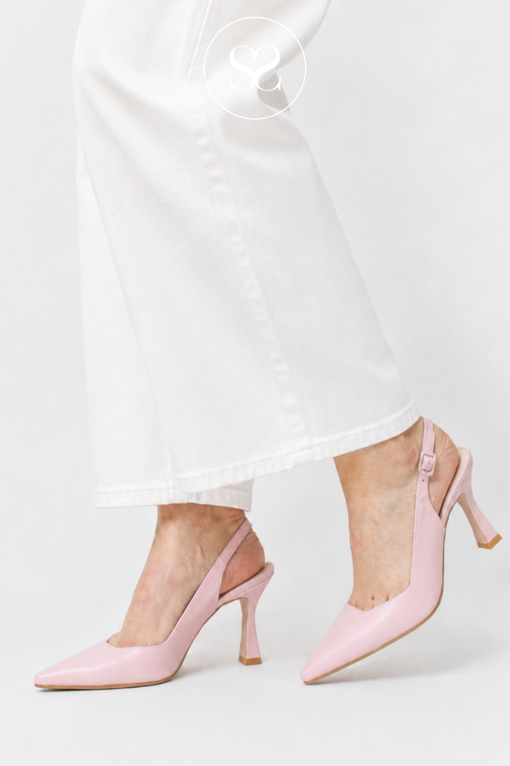 Woman wearing blush pink high heeled slingbacks from Lodi shoes