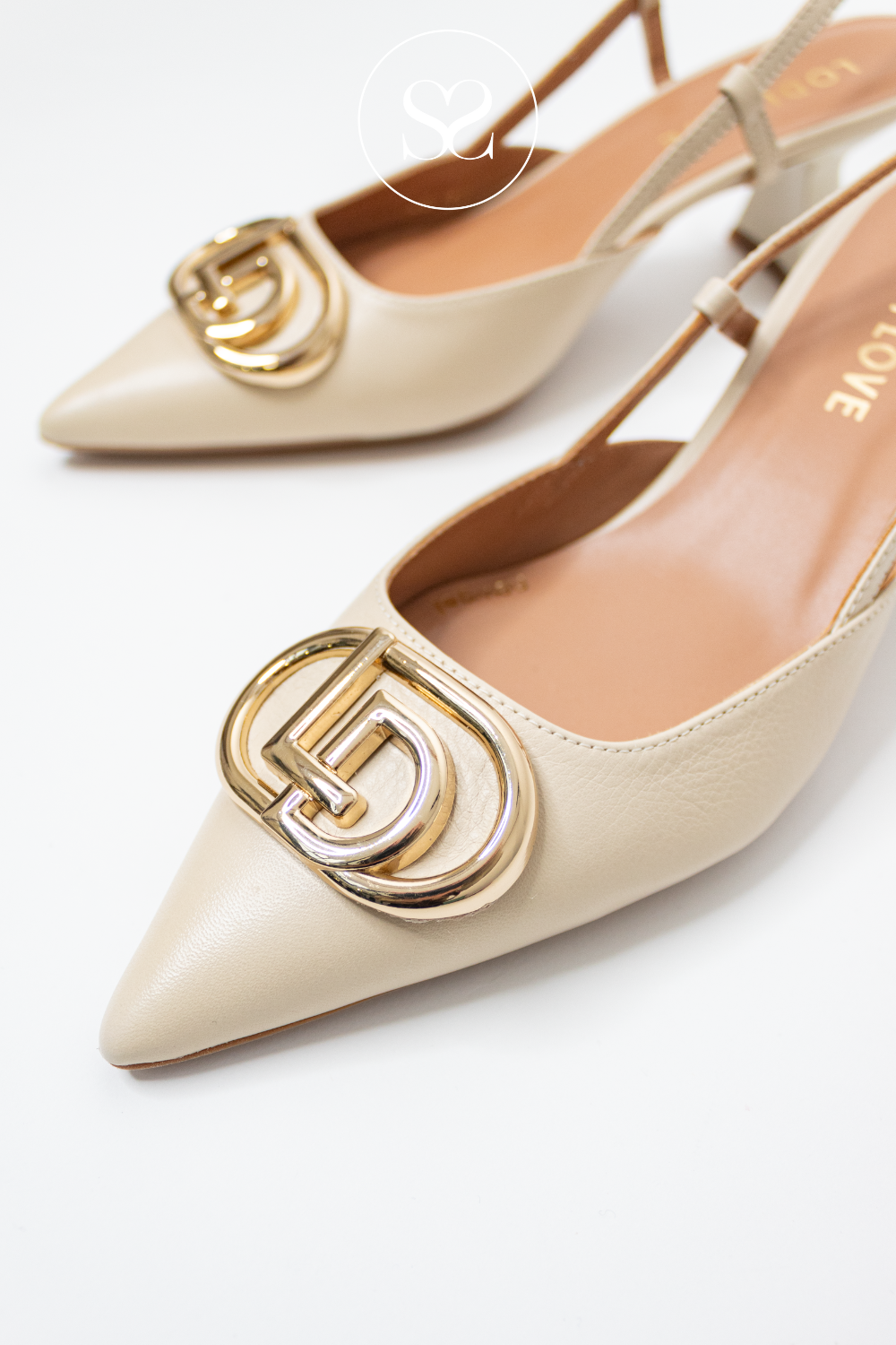 pointed toe pumps from lodi with gold buckle detai;