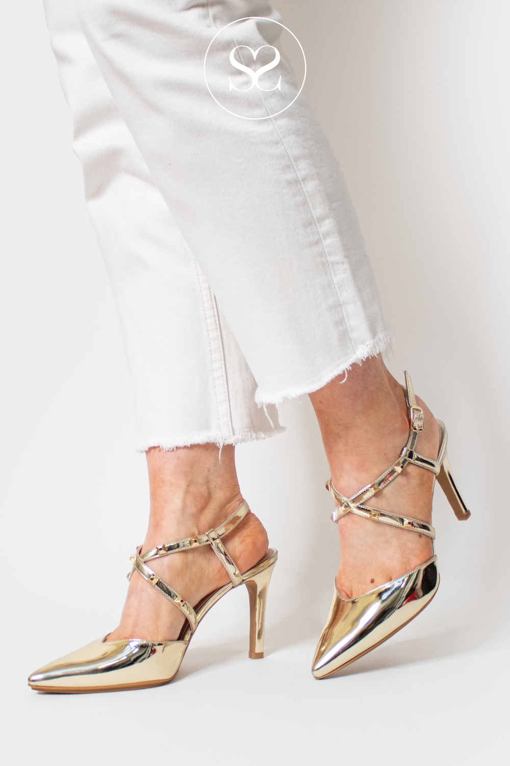 LODI RASIUN GOLD METALLIC MIRRORED POINTED TOE STRAPPY SLINGBACK WITH STUDS ON THE STRAP. HIGH STILETTO HEEL