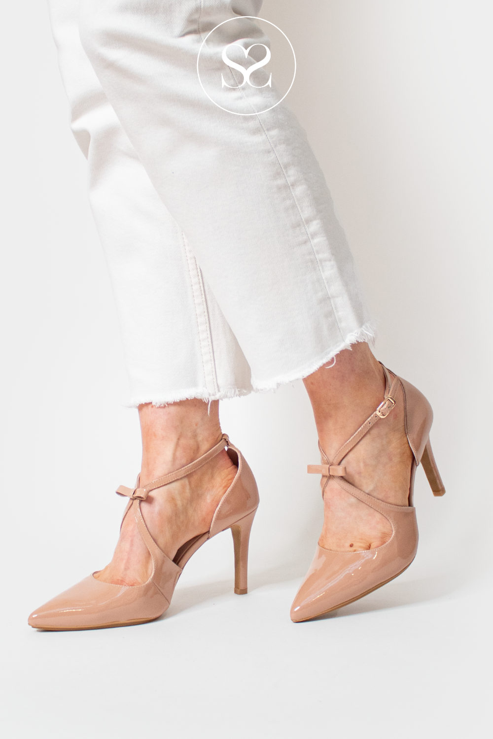 LODI REVECON NUDE PATENT POINTED TOE HIGH HEEL STILETTO WITH V-CUT CRISS CROSS STRAPS WITH BOW