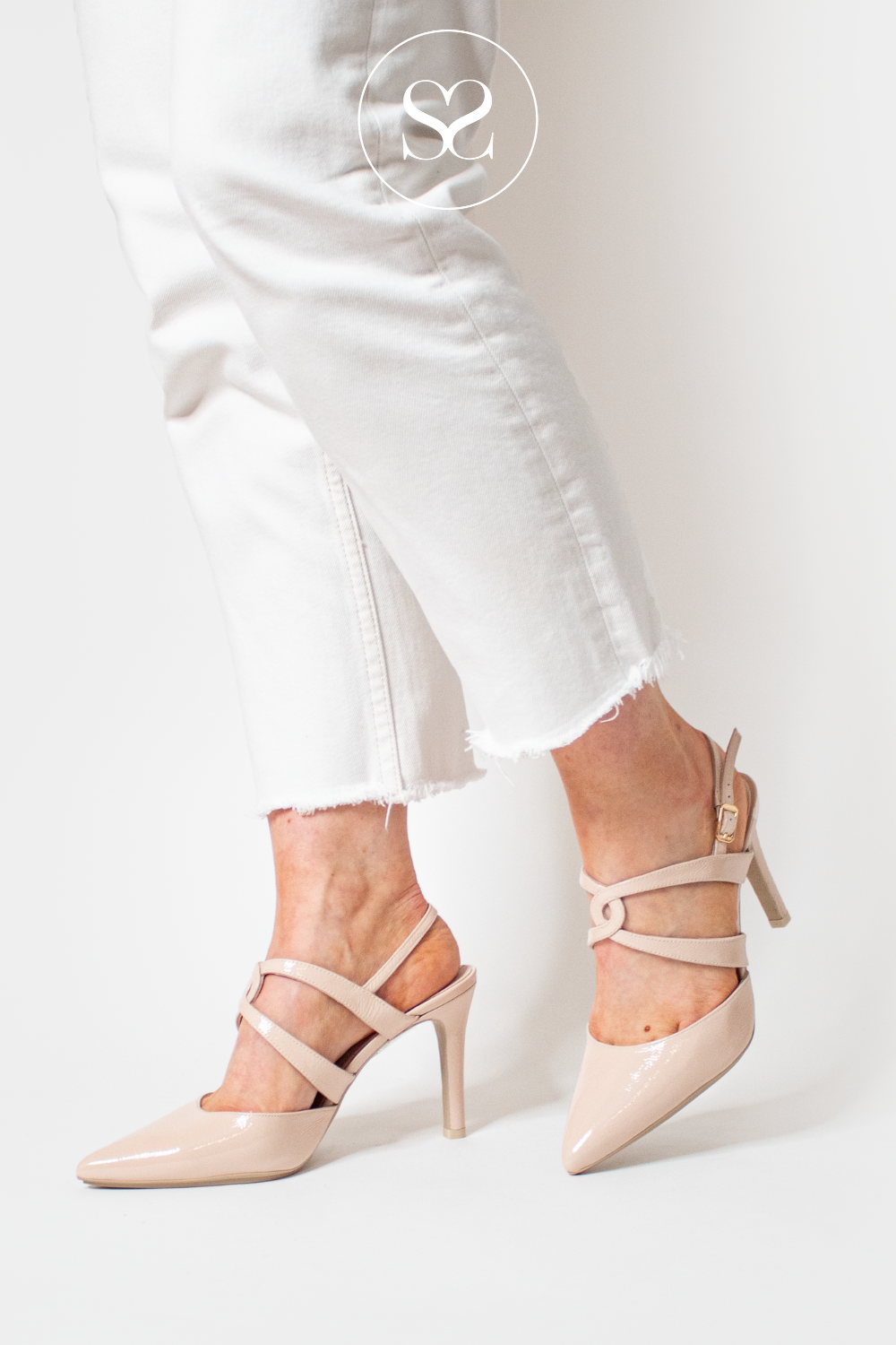 LODI RIANES NUDE PATENT POINTED TOE SLINGBACK WITH ADJUSTABLE STRAP AND CRISS CROSS STRAP DETAIL ACROSS FOOT