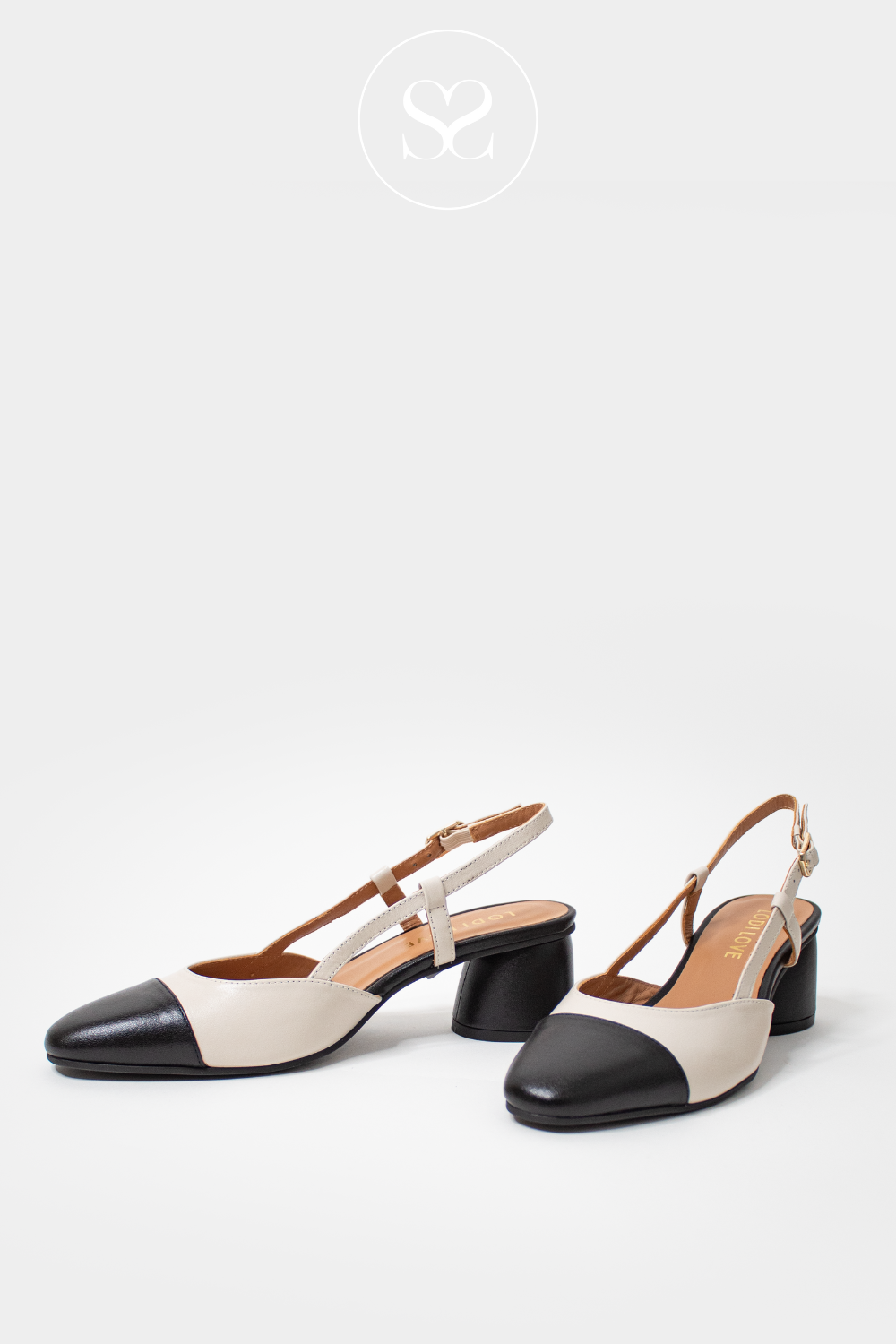 lodi heels with black and cream detailing, sling back design with low block heel