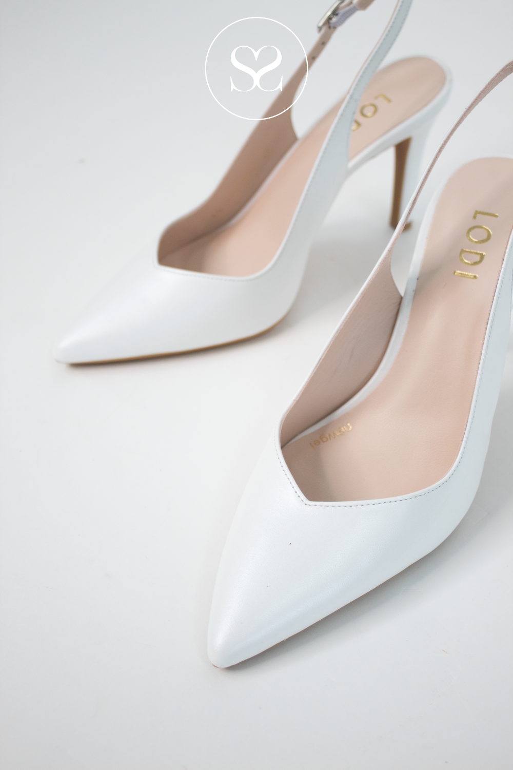 Lodi Raian high heels. Bright white leather heels. Pointed toe slingbacks. V-cut, adjustable ankle strap, gel cushioning