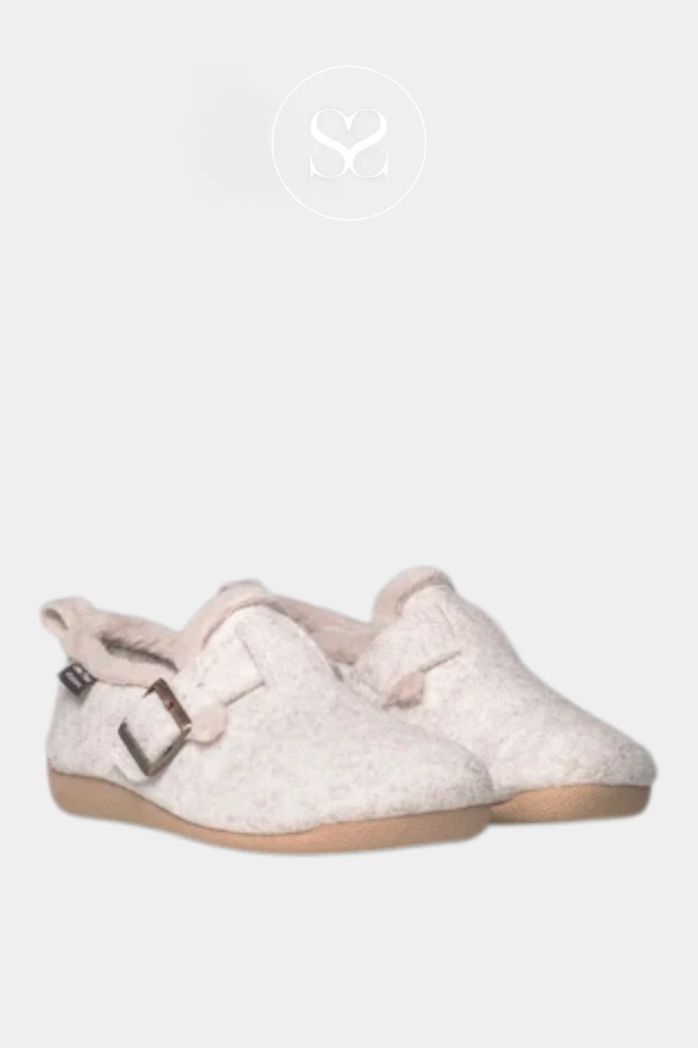 A pair of light beige felt slip-on slippers with a soft pink lining and a small silver buckle detail, shown against a light gray background.