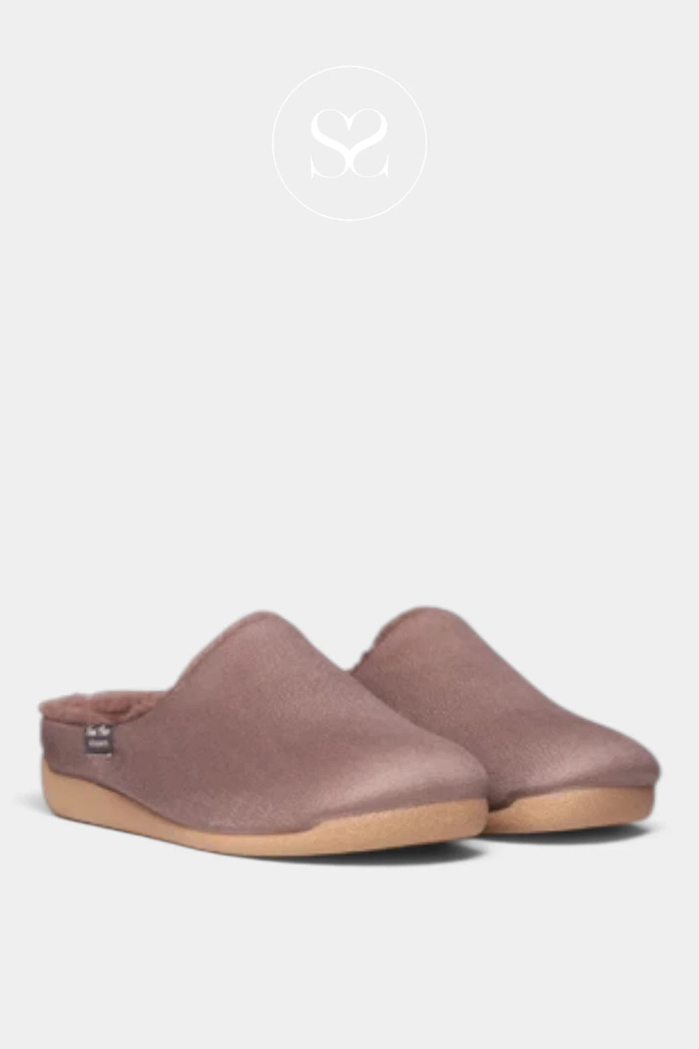 A pair of slip-on clogs in a dusty mauve-brown suede-like material with a tan sole, shown against a light gray background with a faint brand logo at the top.