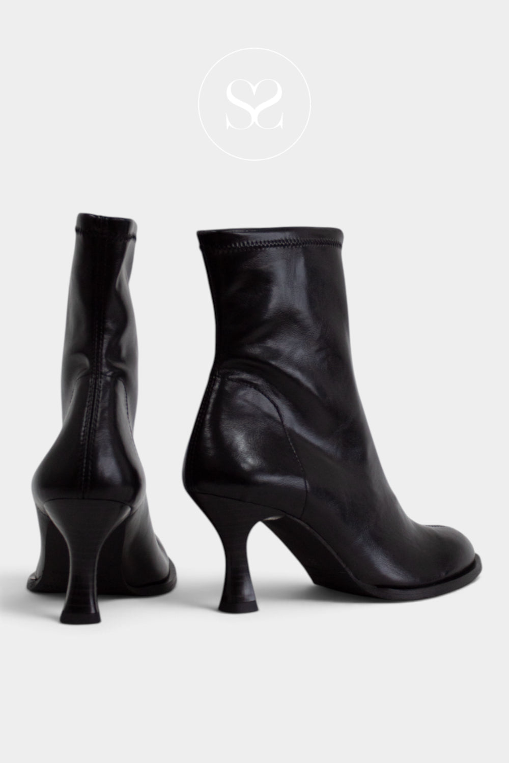 A pair of black leather ankle boots with kitten heels, shown from the side and back on a light grey background from Sheneil Shoes Ireland