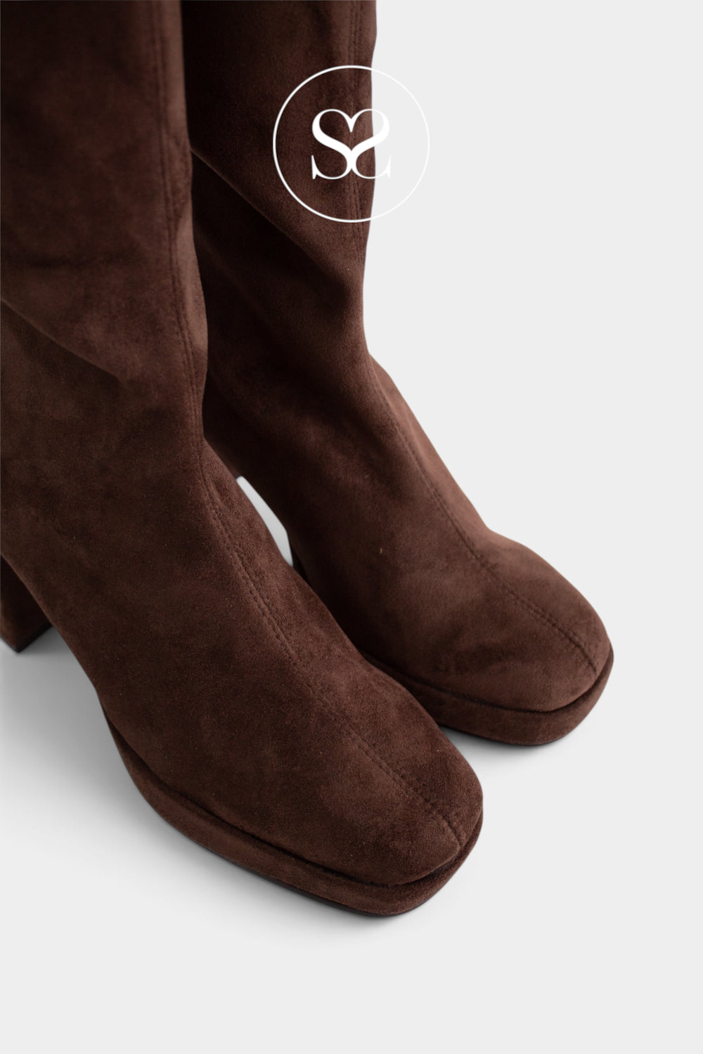 A close-up of a pair of dark brown suede knee high sock boots with a block heel, shown against a light gray background with a white circular 'Sheneil shoes' logo watermark near the top.