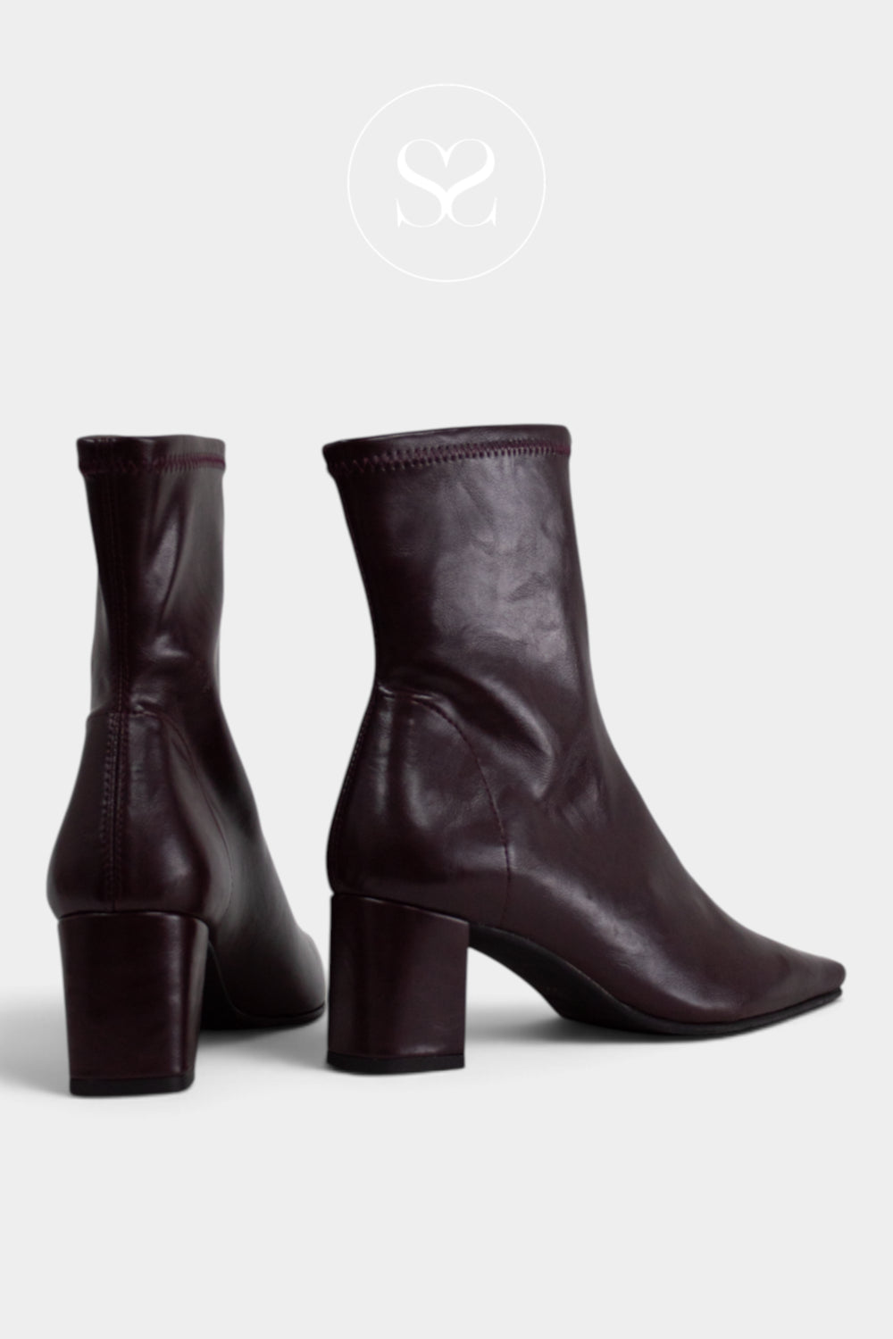 A pair of dark burgundy leather ankle boots with block heels, shown from the side and back on a light grey background.