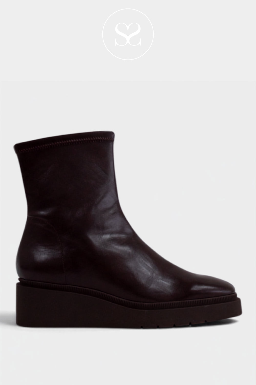 A dark brown leather ankle boot with a chunky platform sole from Miss Elstic, shown from a side profile on a light gray background.