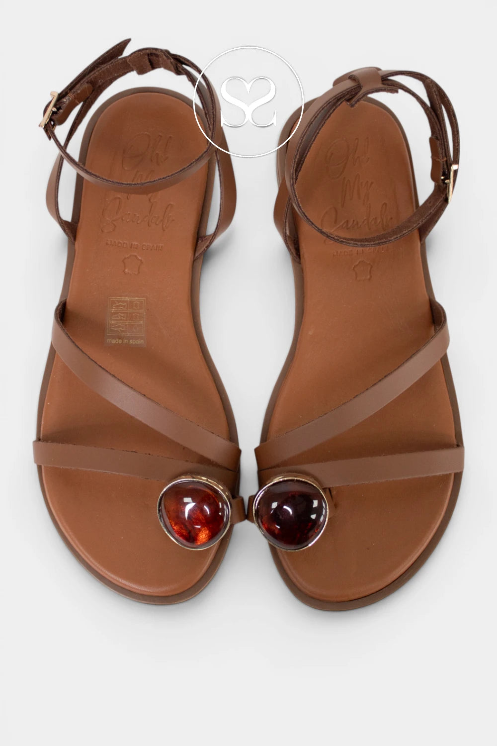 dressy flat tan sandals with toe loop detail and ankle strap