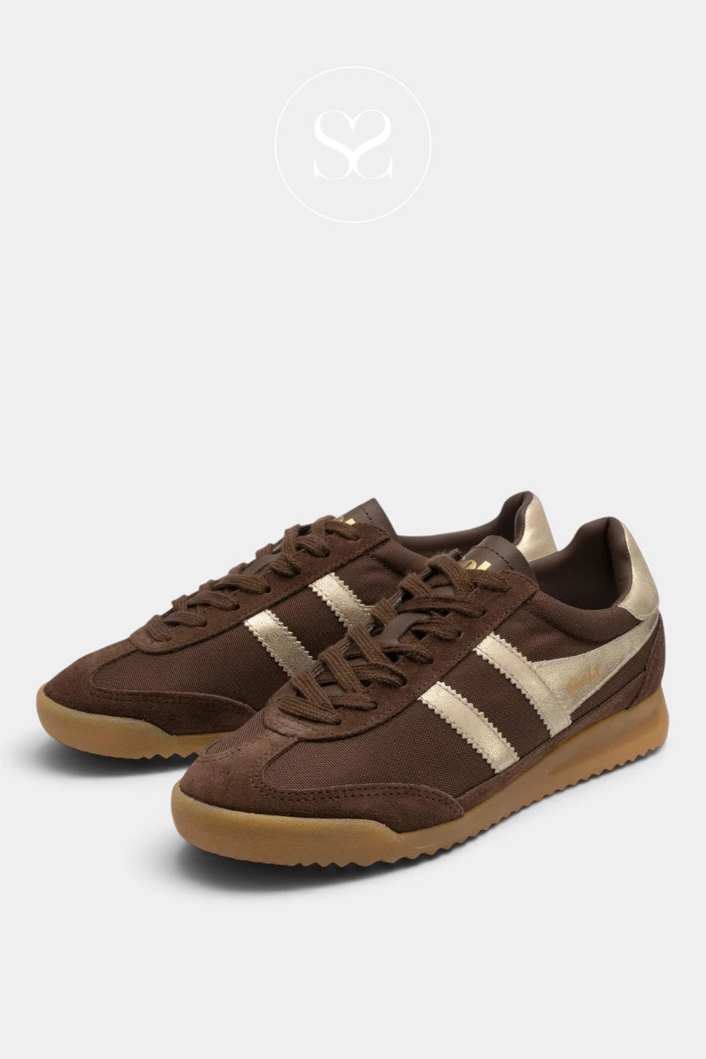 A pair of brown suede and leather sneakers with beige side stripes and a gum sole, displayed on a light gray background.