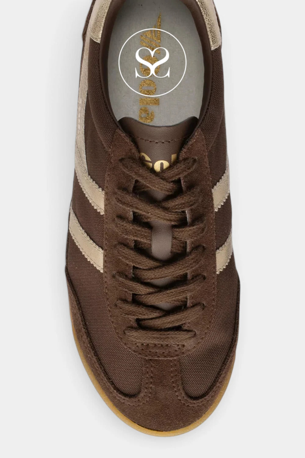 A top-down view of a brown suede sneaker with beige side stripes and a gum sole, featuring a circular logo on the insole.