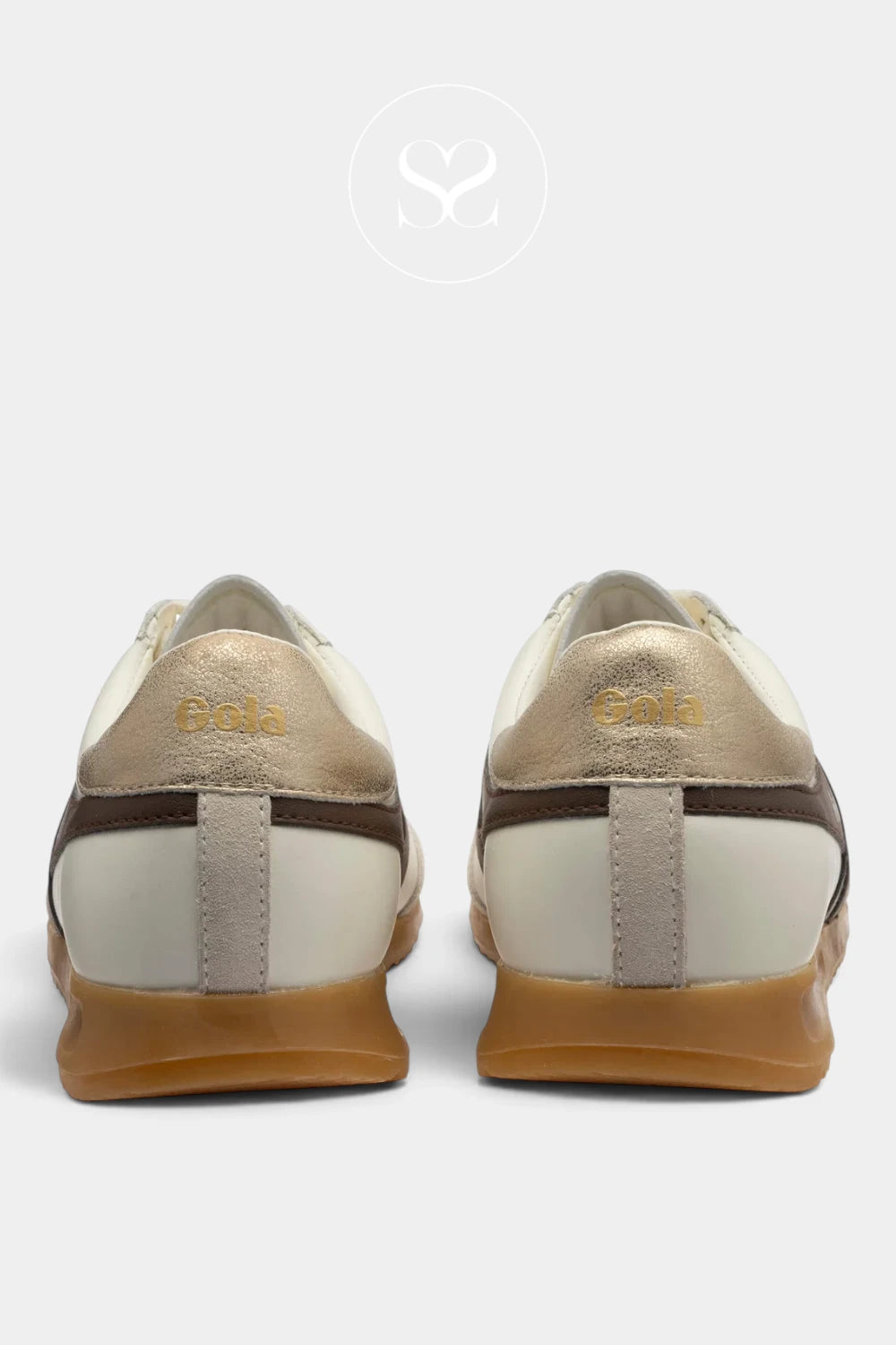 A pair of low-top sneakers shown from the back, featuring metallic gold leather uppers, off-white leather panels, dark brown side stripes, and tan rubber soles, set against a light gray background.