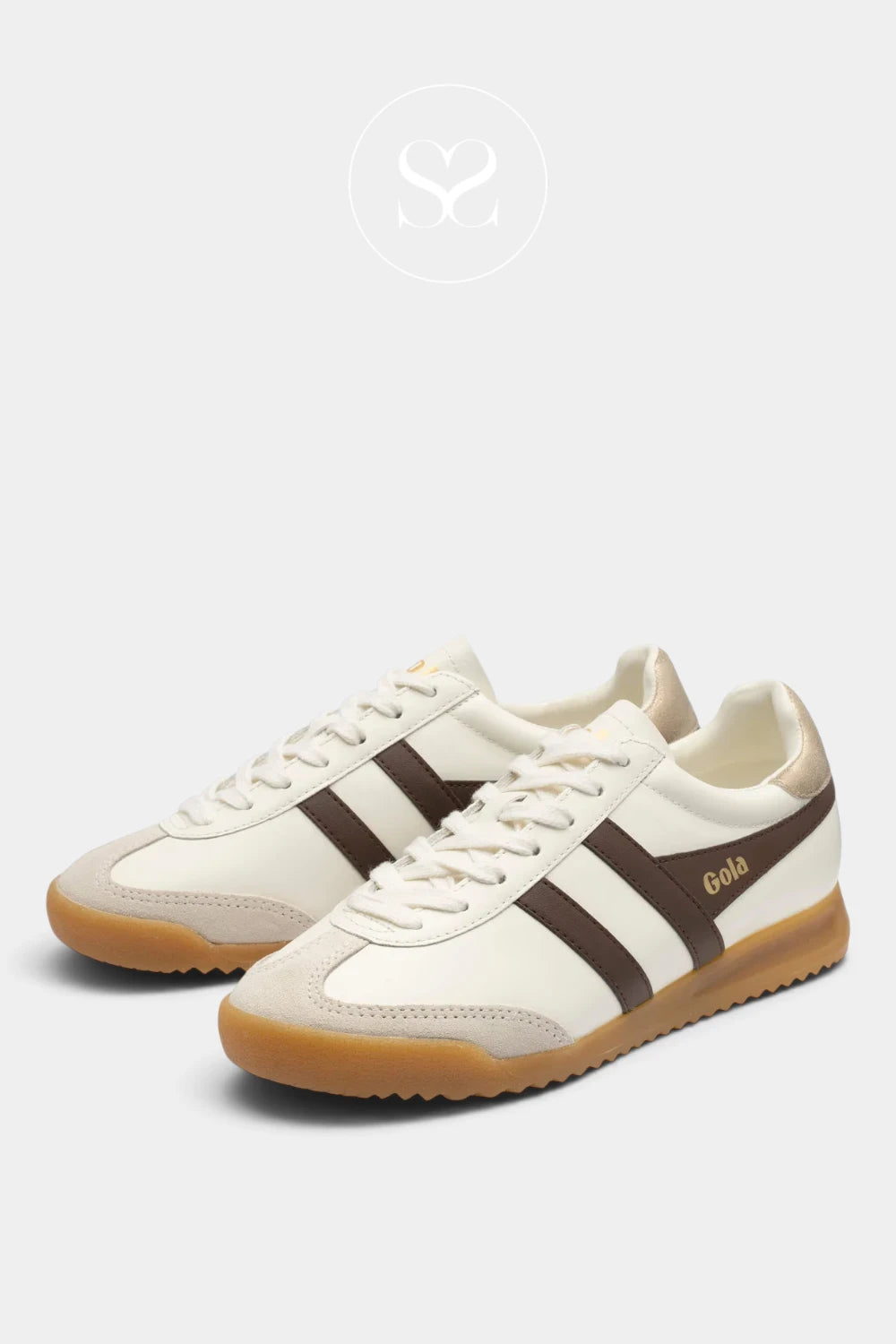 A pair of low-top sneakers in off-white leather with dark brown side stripes, a gold 'Gola' logo, and a gum sole, shown on a light gray background.