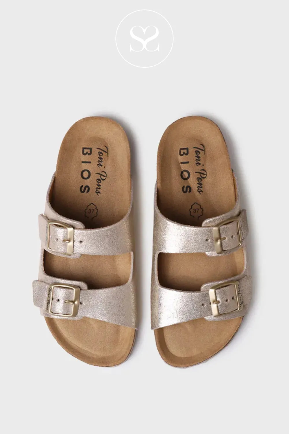 Gold slider sandals with cushioned footbed. Double strap sliders