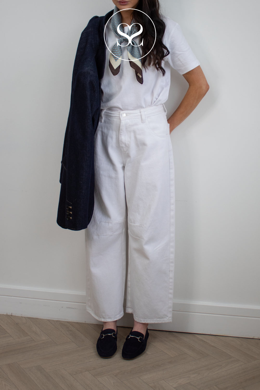 woman wearing navy suede penny loafers from Unisa - Belgi style
