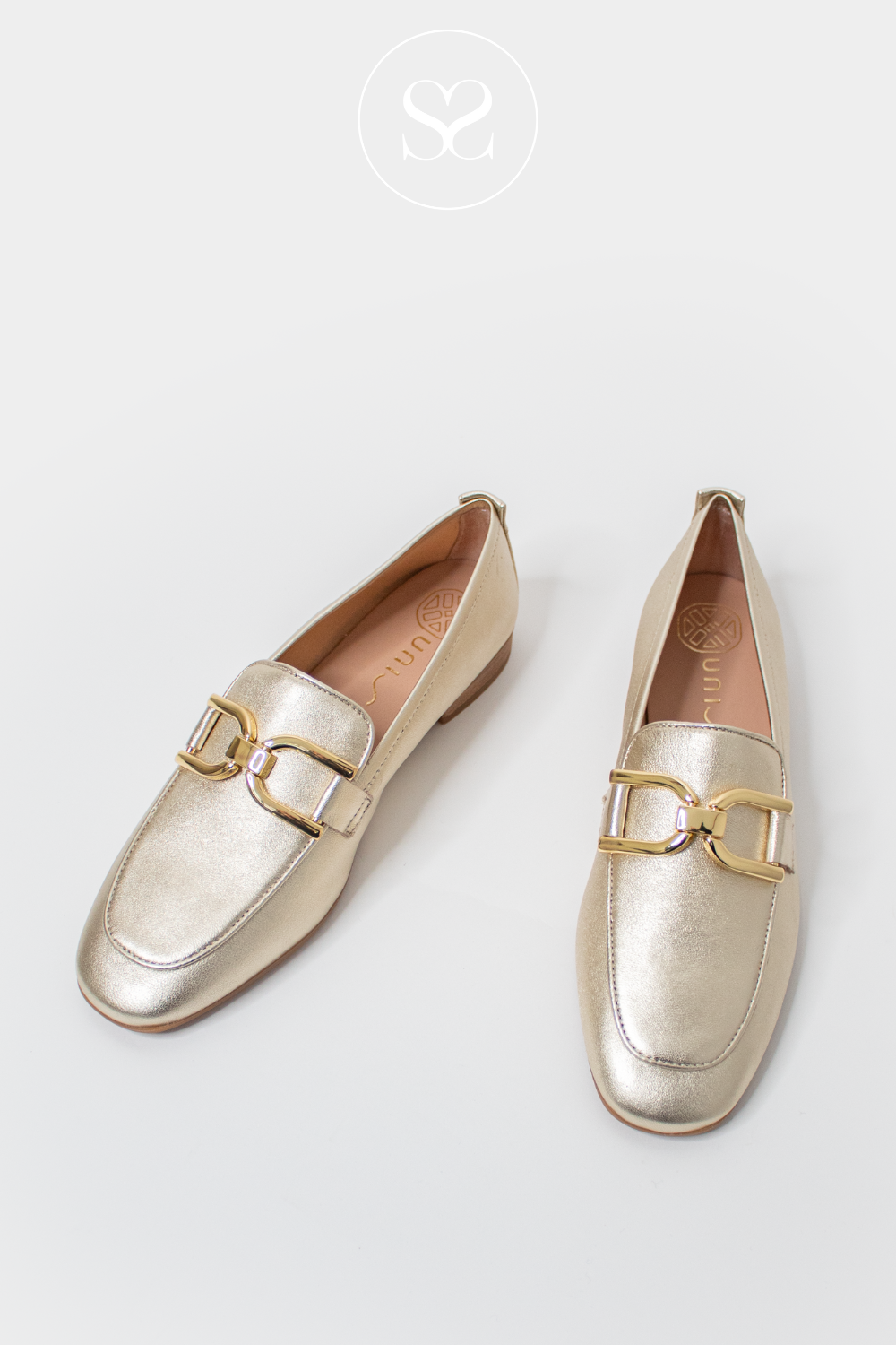 UNISA BAXTER GOLD LEATHER FLAT SLIP ON LOAFERS WITH GOLD BUCKLE