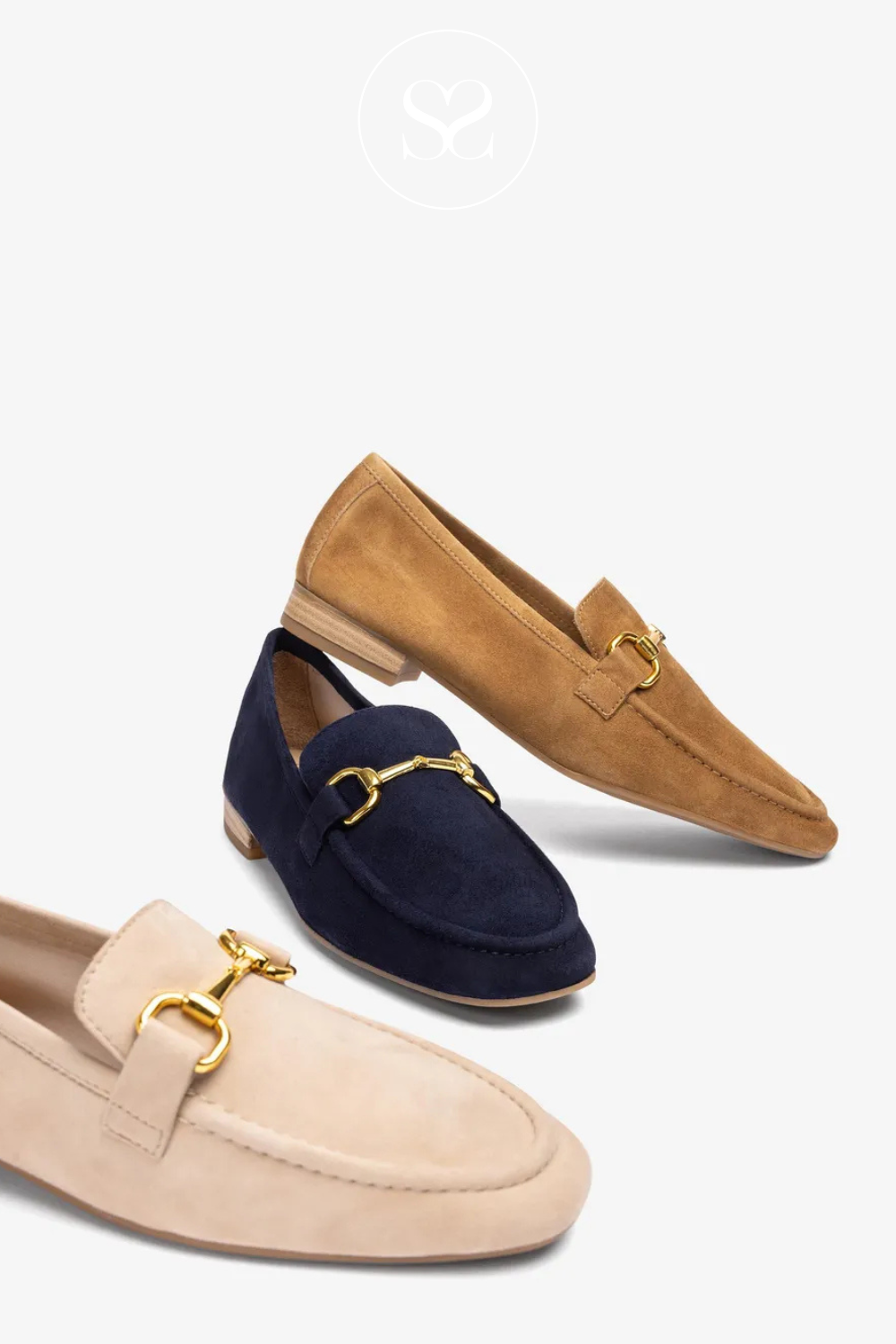 Pair of camel tan suede loafers with slightly squared round toe. Gold chain buckle, low block heel, flat sole and cushioned footbed. Suitable everyday workwear shoe. Office wear. Also available in navy suede and buttercream yellow.