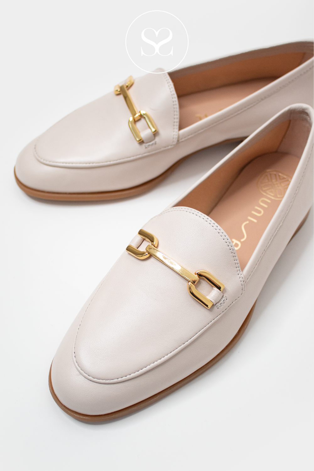UNISA DALCY IVORY LEATHER FLAT SLIP ON LOAFERS WITH GOLD BUCKLE