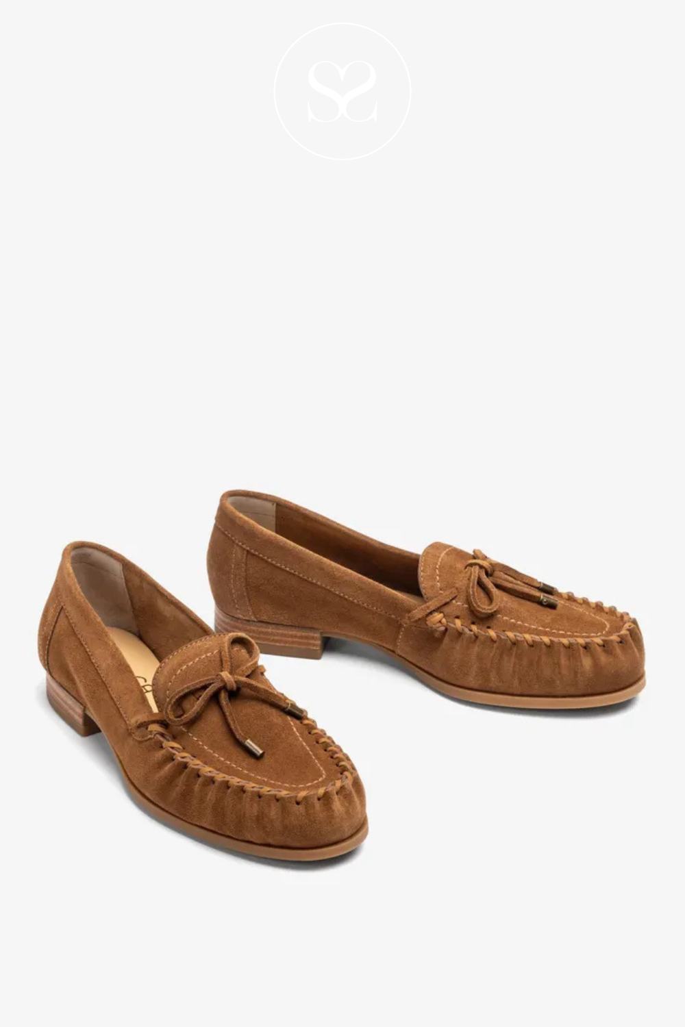Spanish leather slip on round toe shoes. Bow and twist round toe. Cushioned insole. 