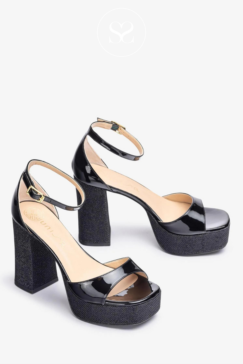 UNISA UPTON BLACK PATENT PLATFORM BLOCK HEEL SANDAL WITH AN ANKLE STRAP AND A SPARKLE SOLE