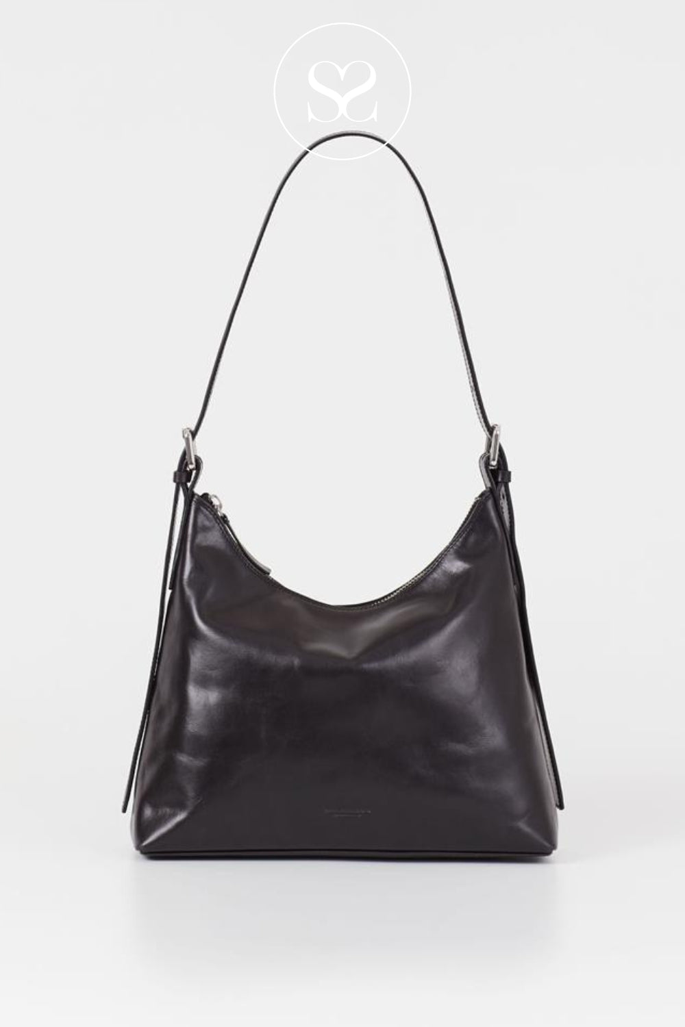 A black leather slouchy shoulder bag with a single thin strap from Vagabond Shoemakers, photographed against a plain light gray background for Sheneil Shoes Galway Ireland