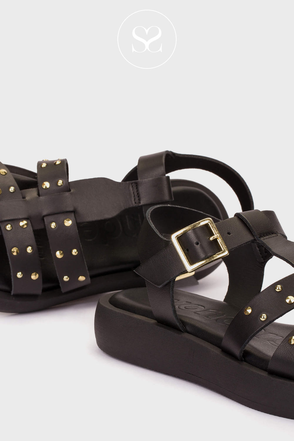 Wonders A-1567 black and gold sandals. Black leather and gold studded hardware. Comfortable sole and adjustable ankle strap