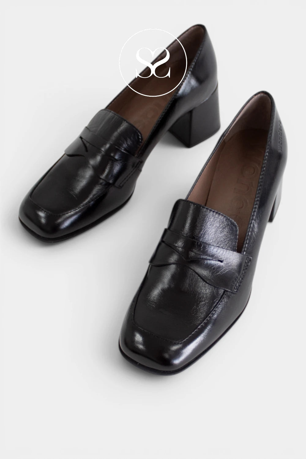 Women’s black leather loafers with a block heel, combining classic penny loafer styling with an elegant, elevated silhouette - Ireland
